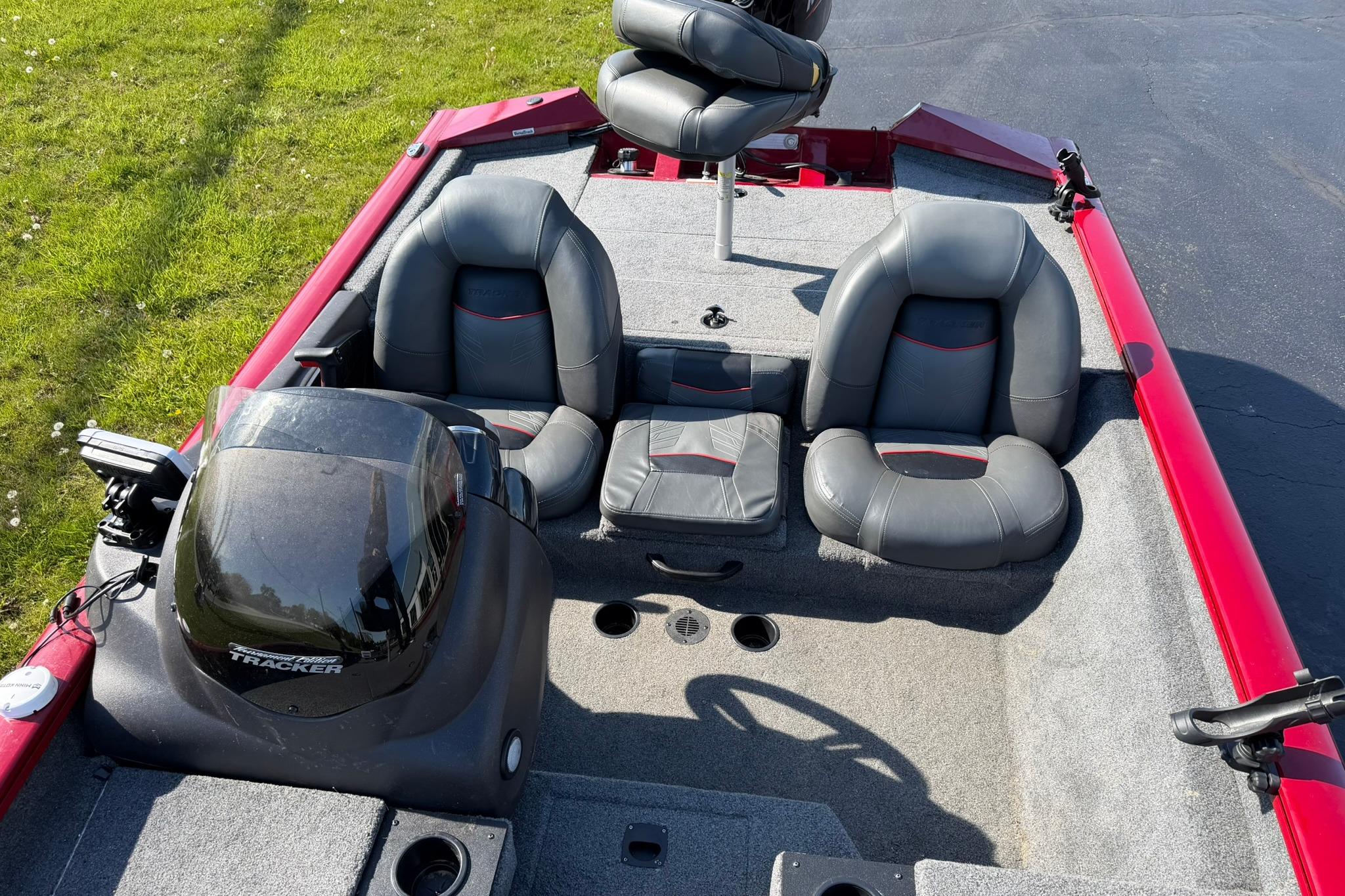 2024 Tracker Pro Team 175 TXW boat interior with gray seating and red accents.
