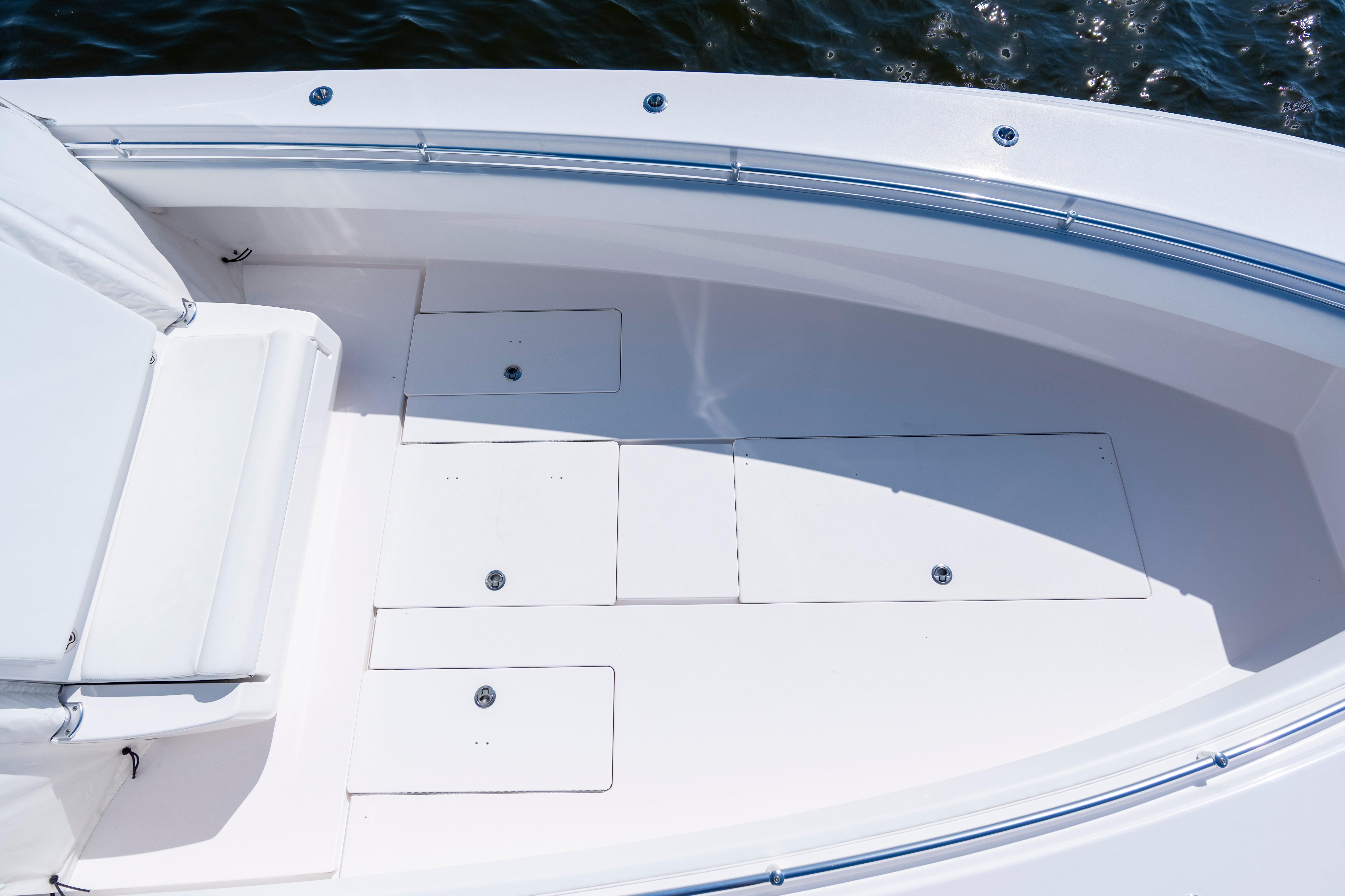 2015 Contender 39 ST boat deck with storage compartments and seating.