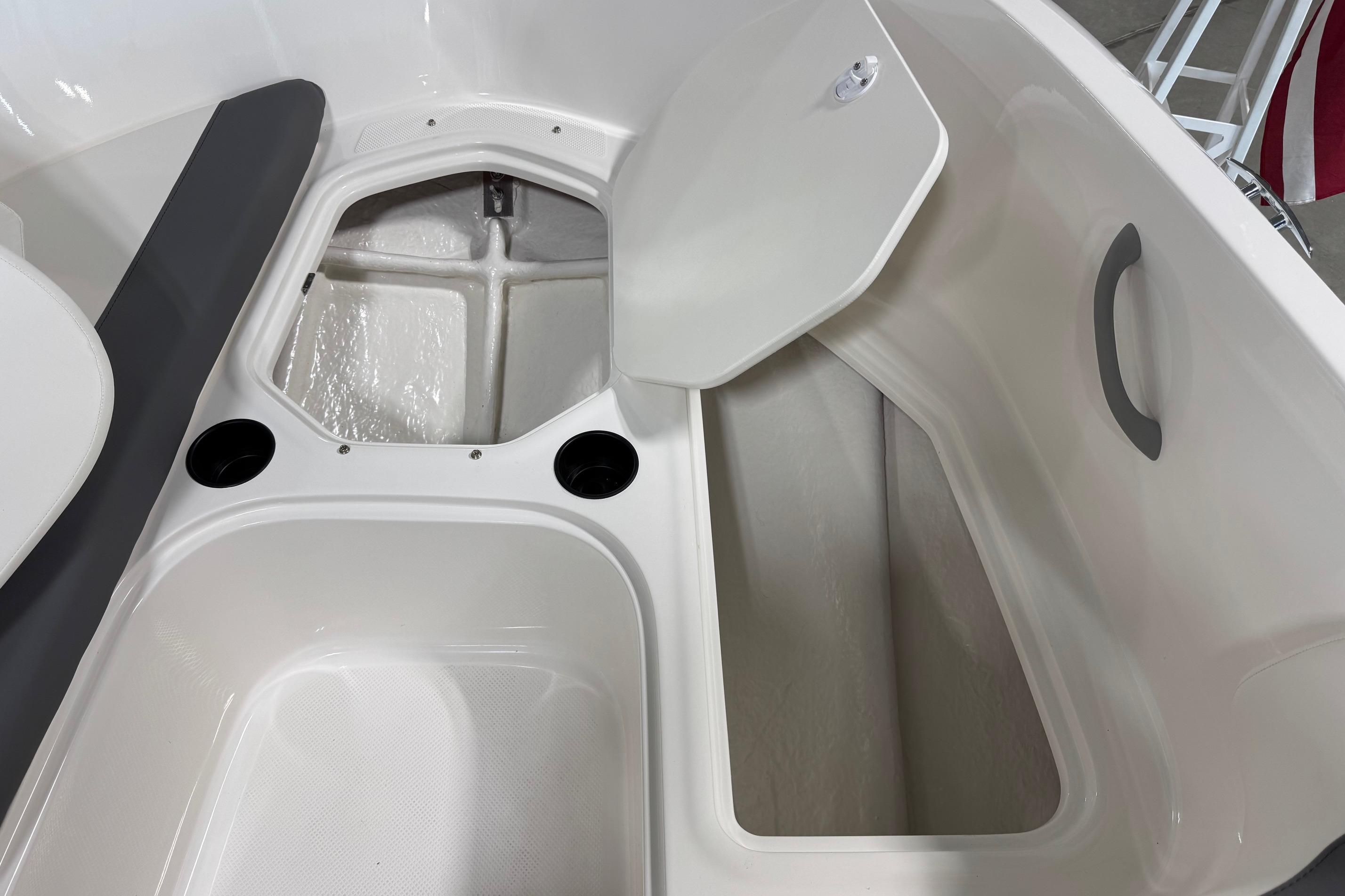 2026 Bayliner Element E18 boat interior storage compartments and seating area.