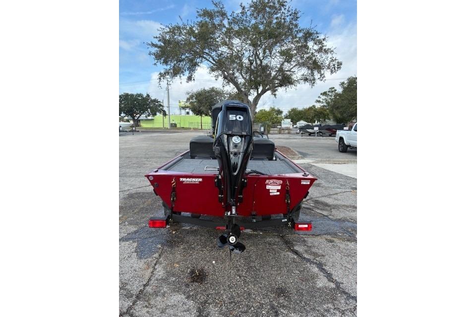 2025 Tracker Bass Tracker Classic XL boat with 50 HP motor, parked outdoors.