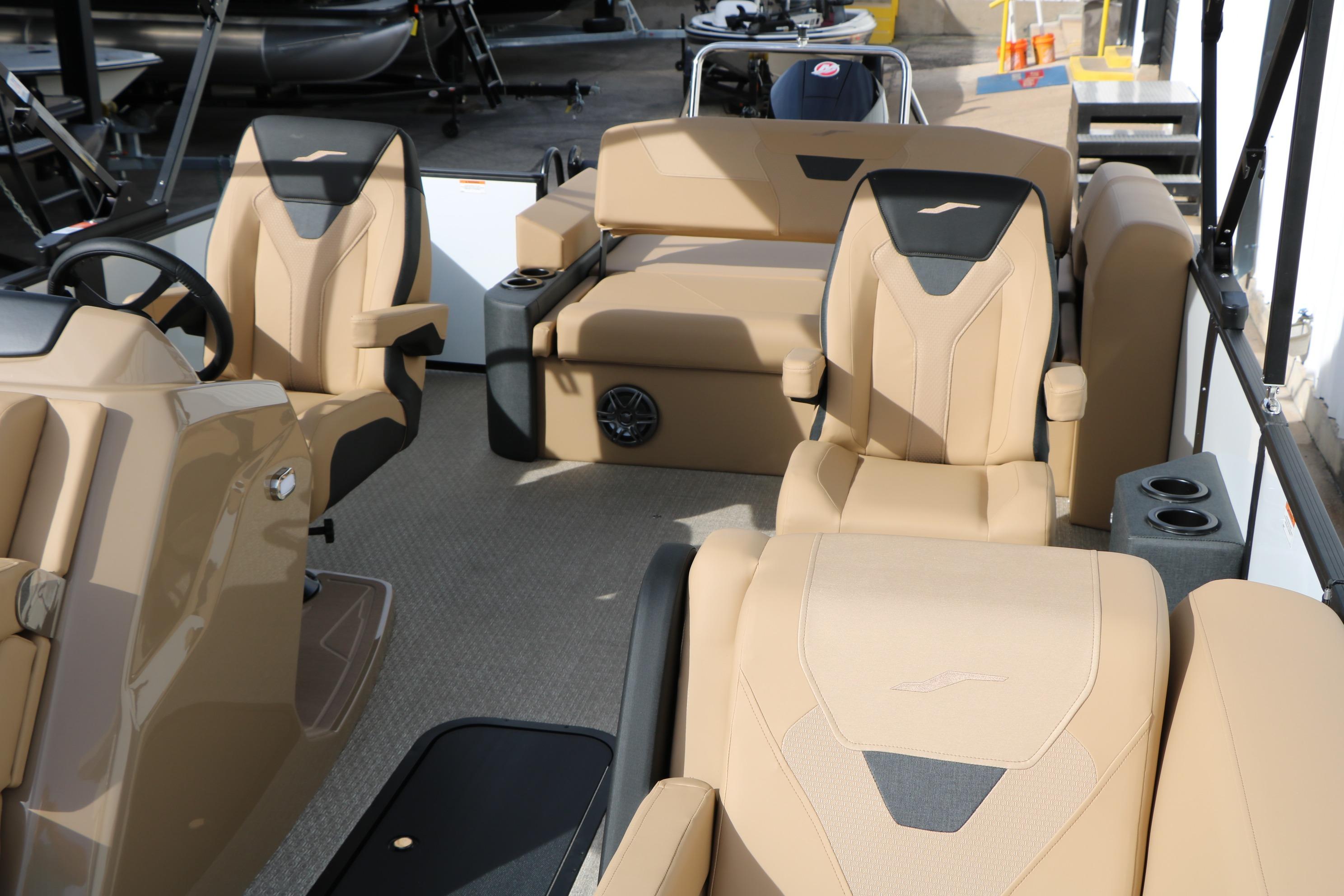 Luxurious interior of 2026 Evotti 523CS boat with beige seating and modern design.