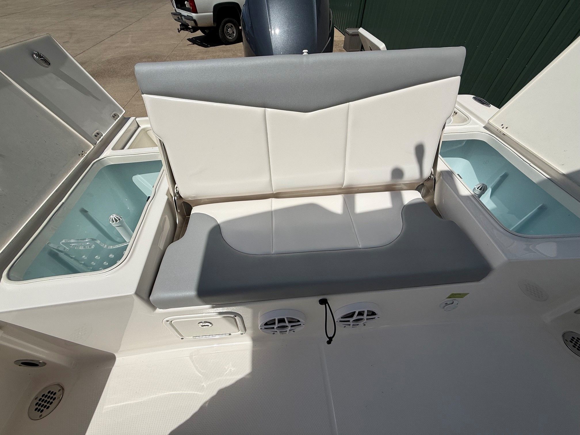2021 Robalo 226 Cayman with seating and storage compartments.