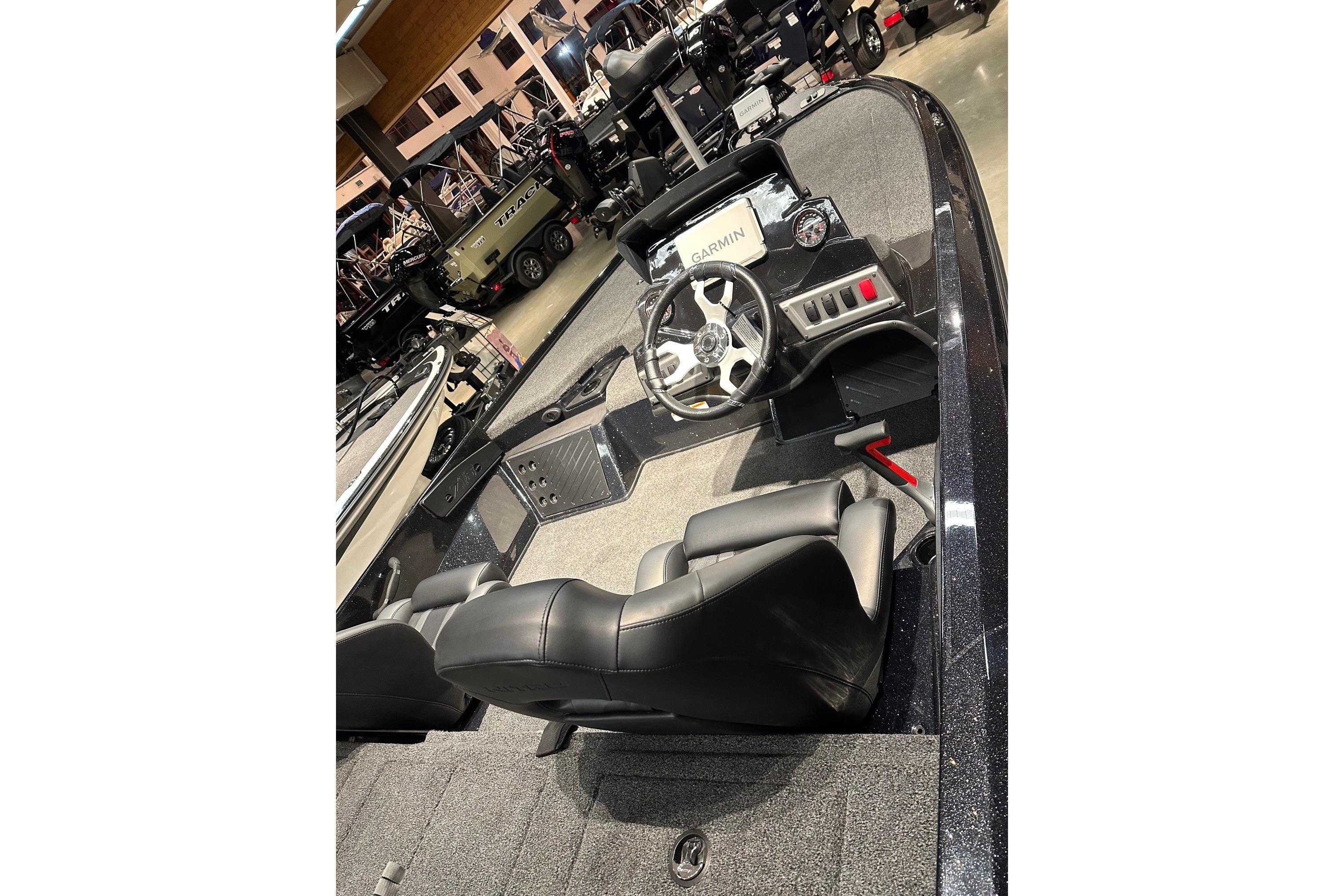 2026 Nitro Z18 Pro boat interior with steering wheel and Garmin display.