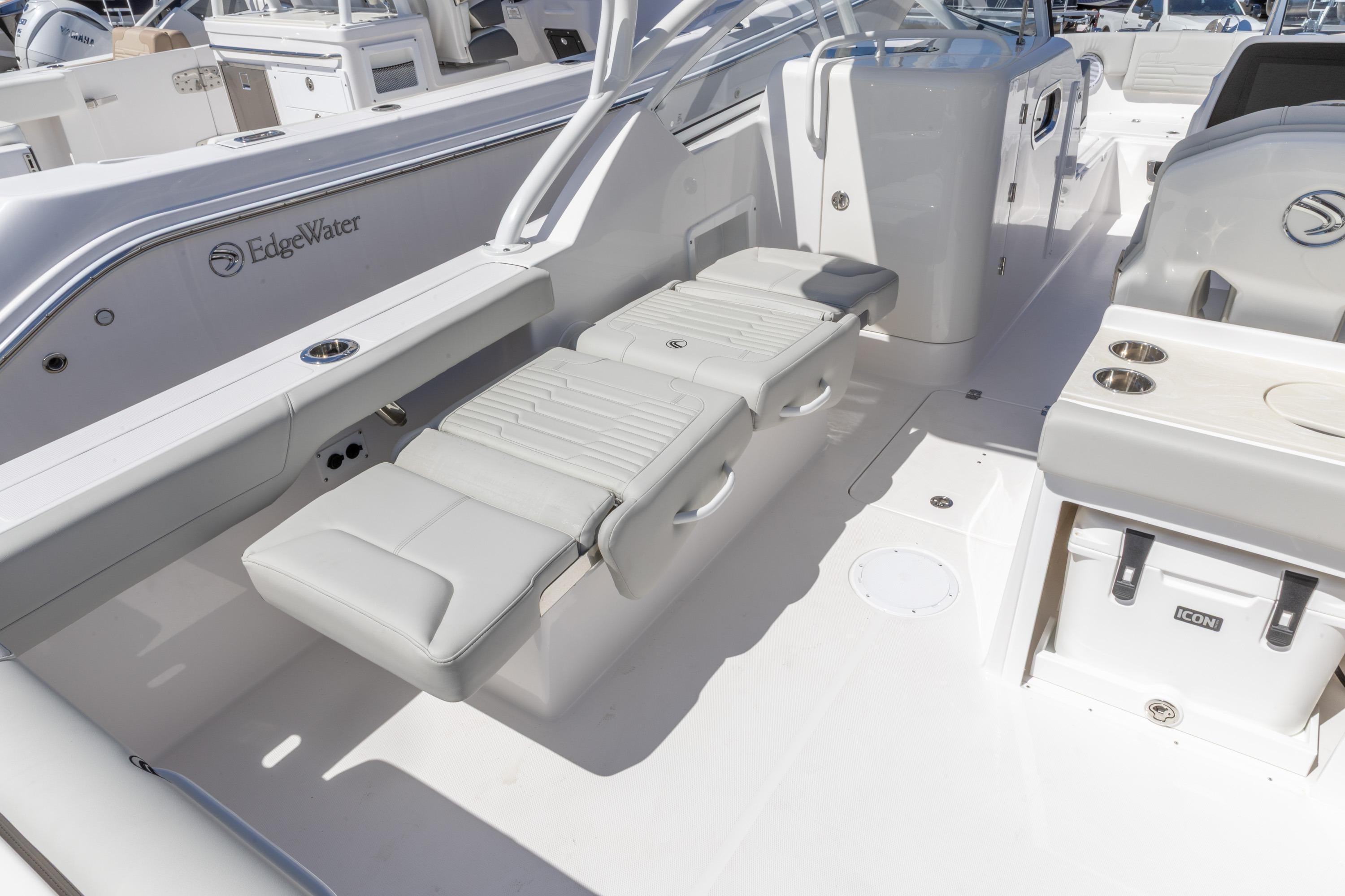 2026 Edgewater 248CX Crossover boat interior with seating and storage features.