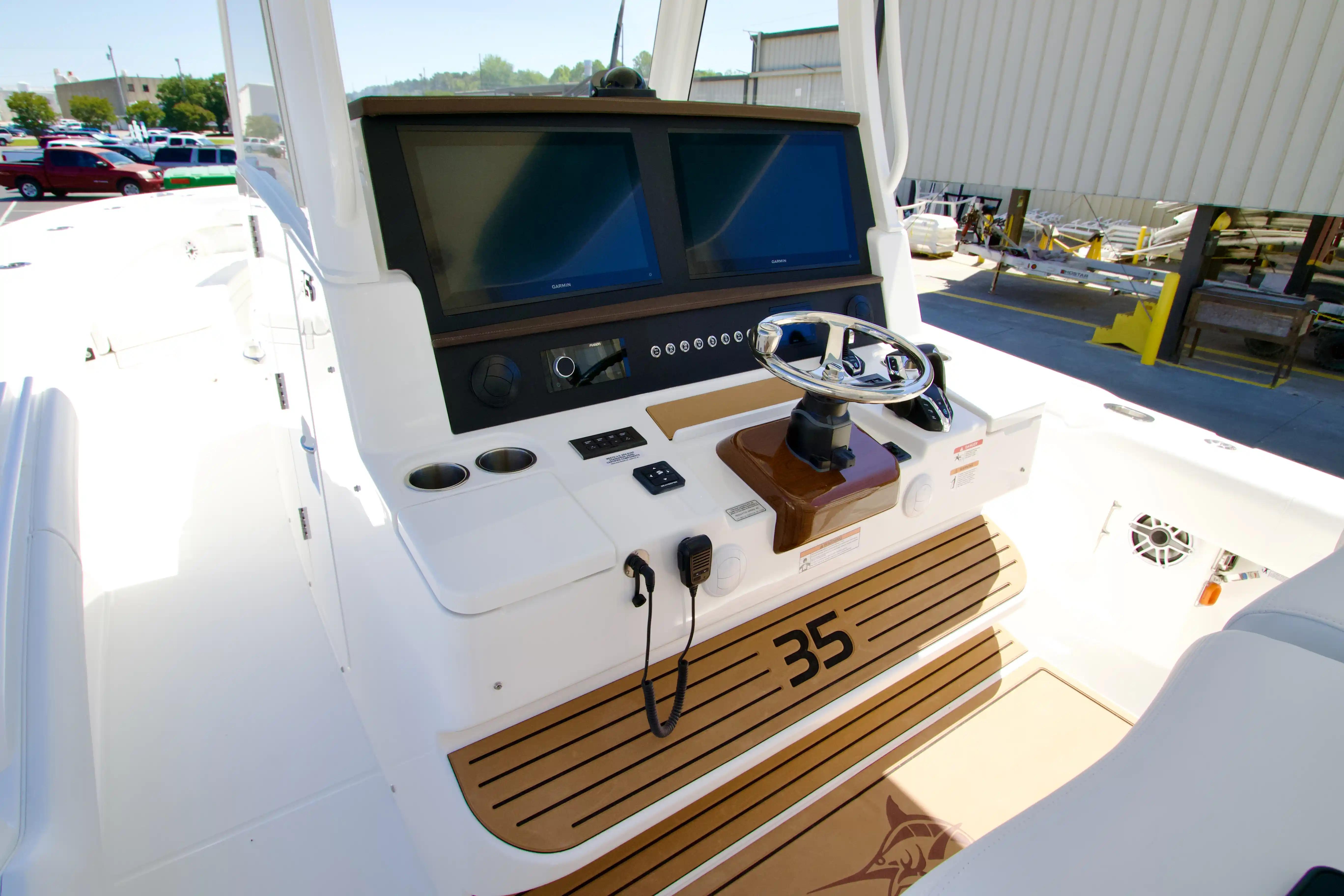 Helm of 2027 Regulator 35 boat with dual screens and modern controls.