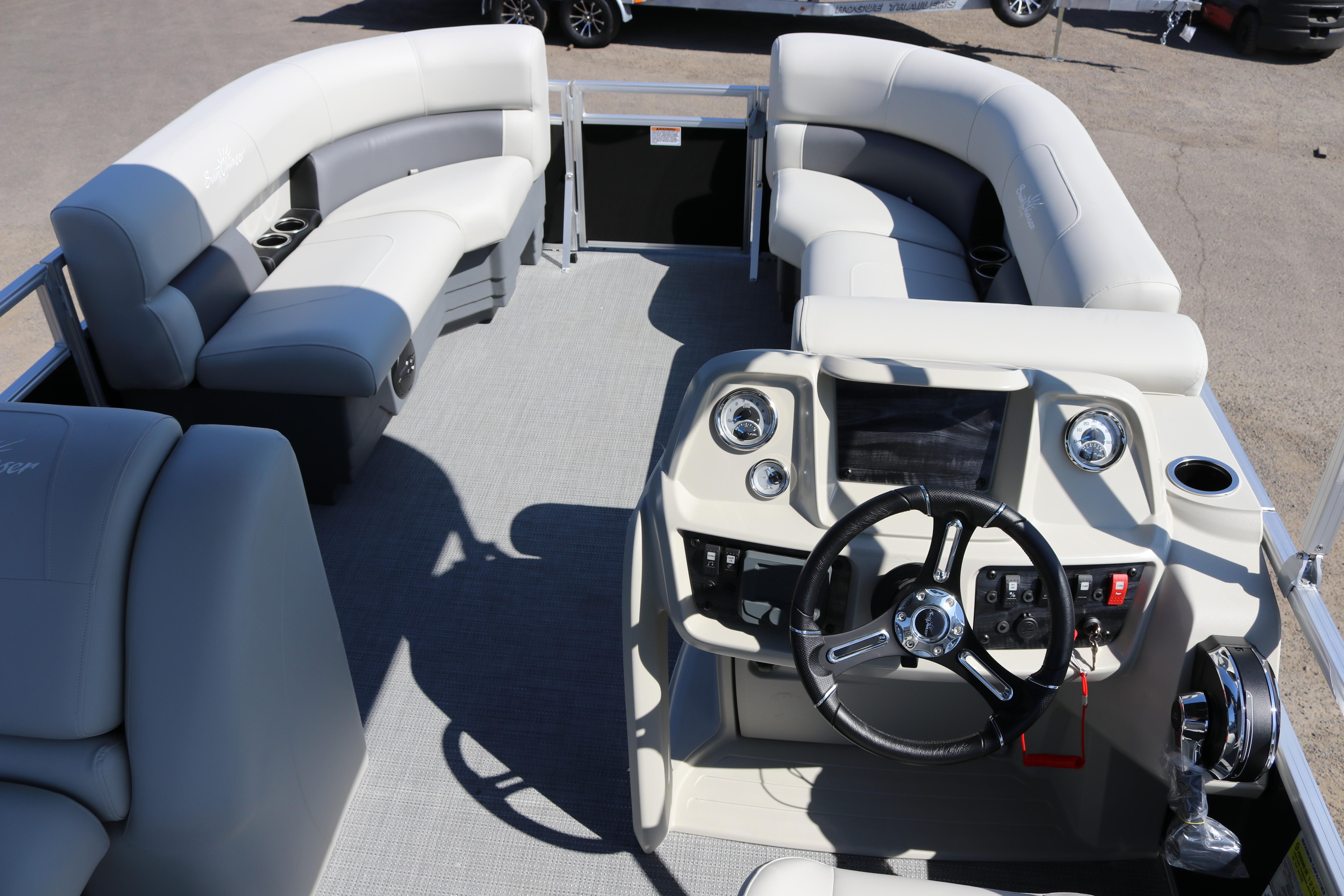 2025 SunChaser Vista 20 Fish boat interior with plush seating and modern helm controls.