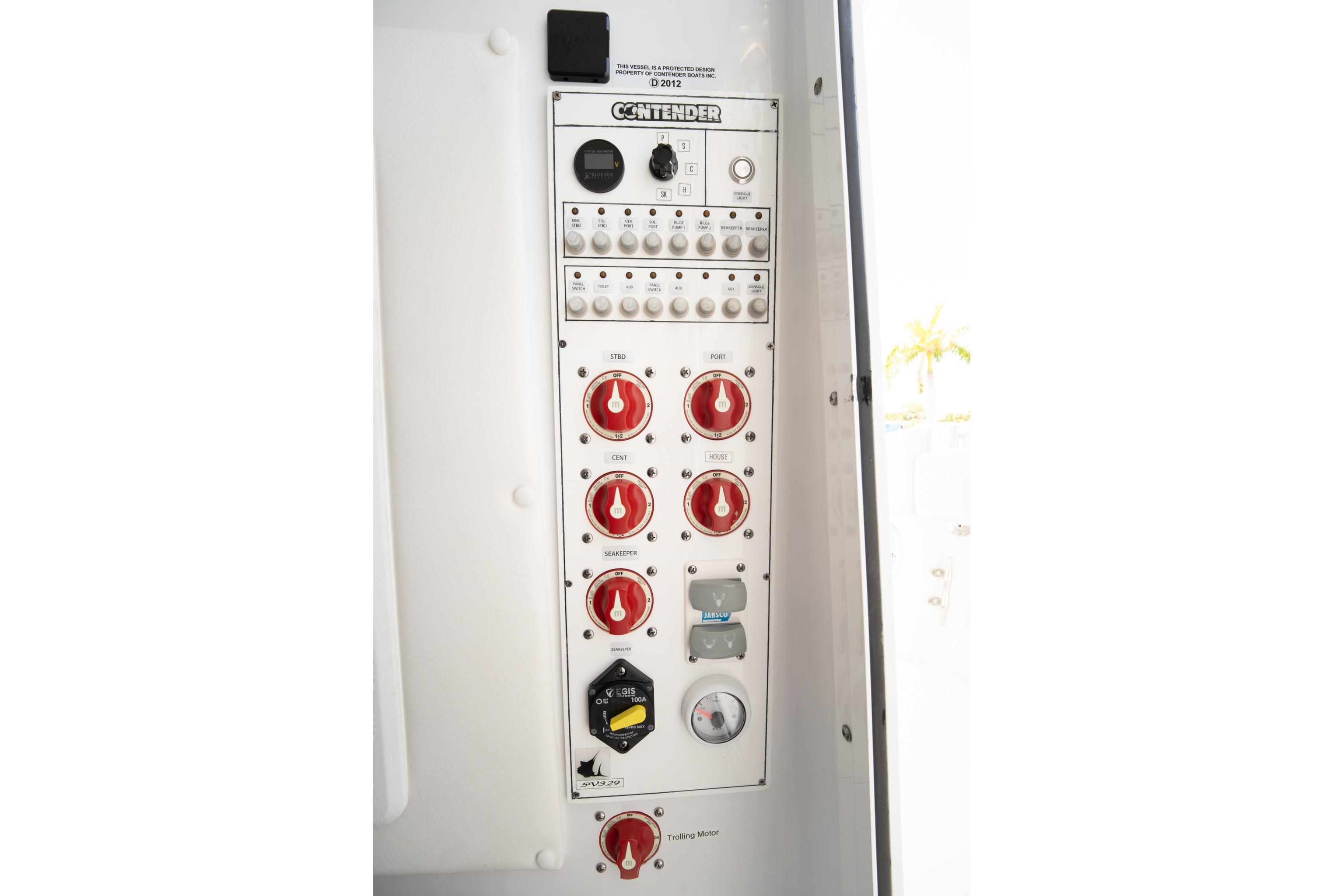 Control panel of 2024 Contender 35 ST boat with switches and dials.