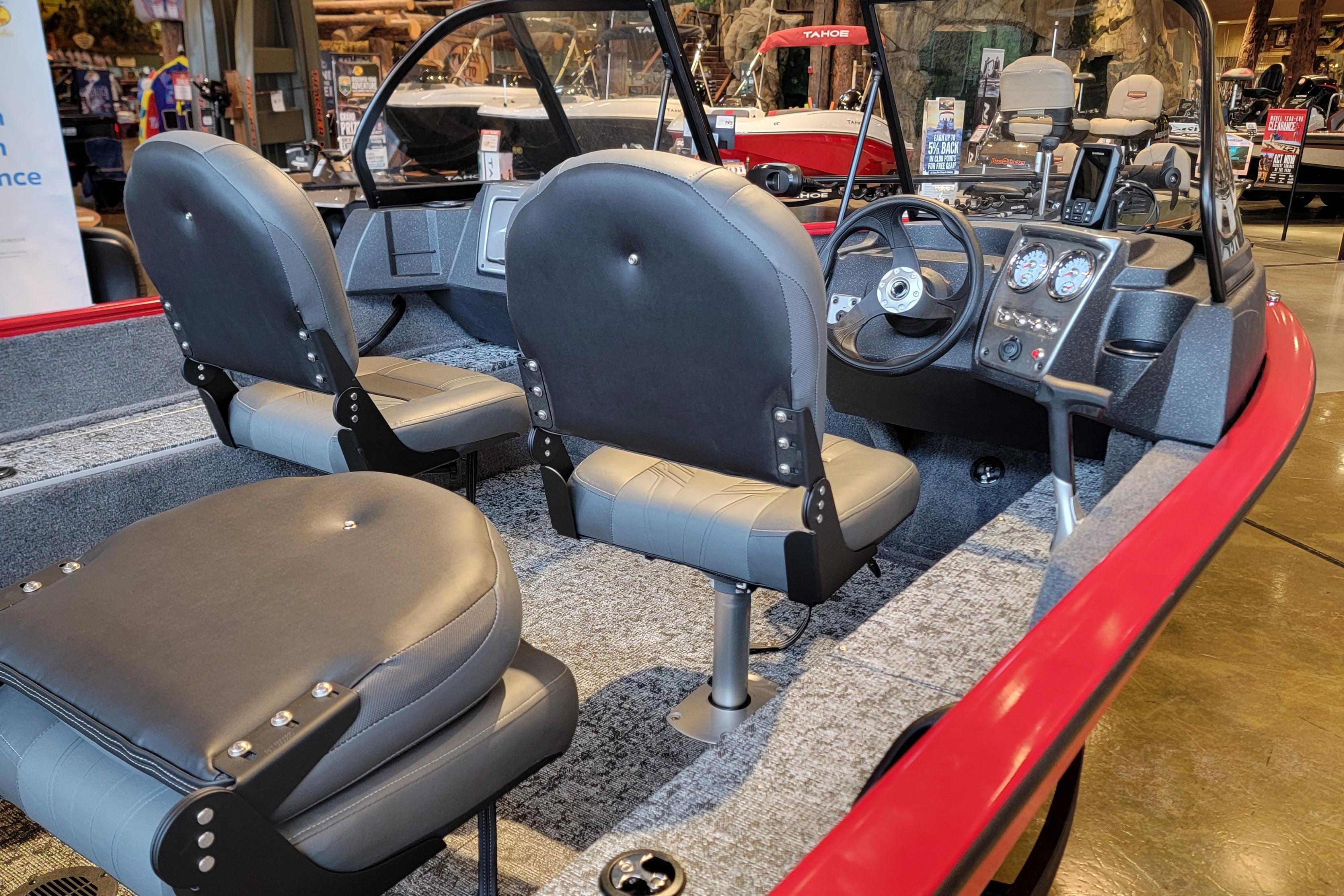2026 Tracker Pro Guide V-16 WT boat interior with gray seats and steering console.