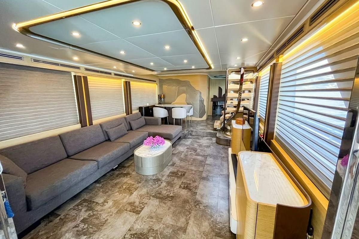 Luxurious interior of 1989 Mengi Yay Custom yacht with modern furnishings and ambient lighting.
