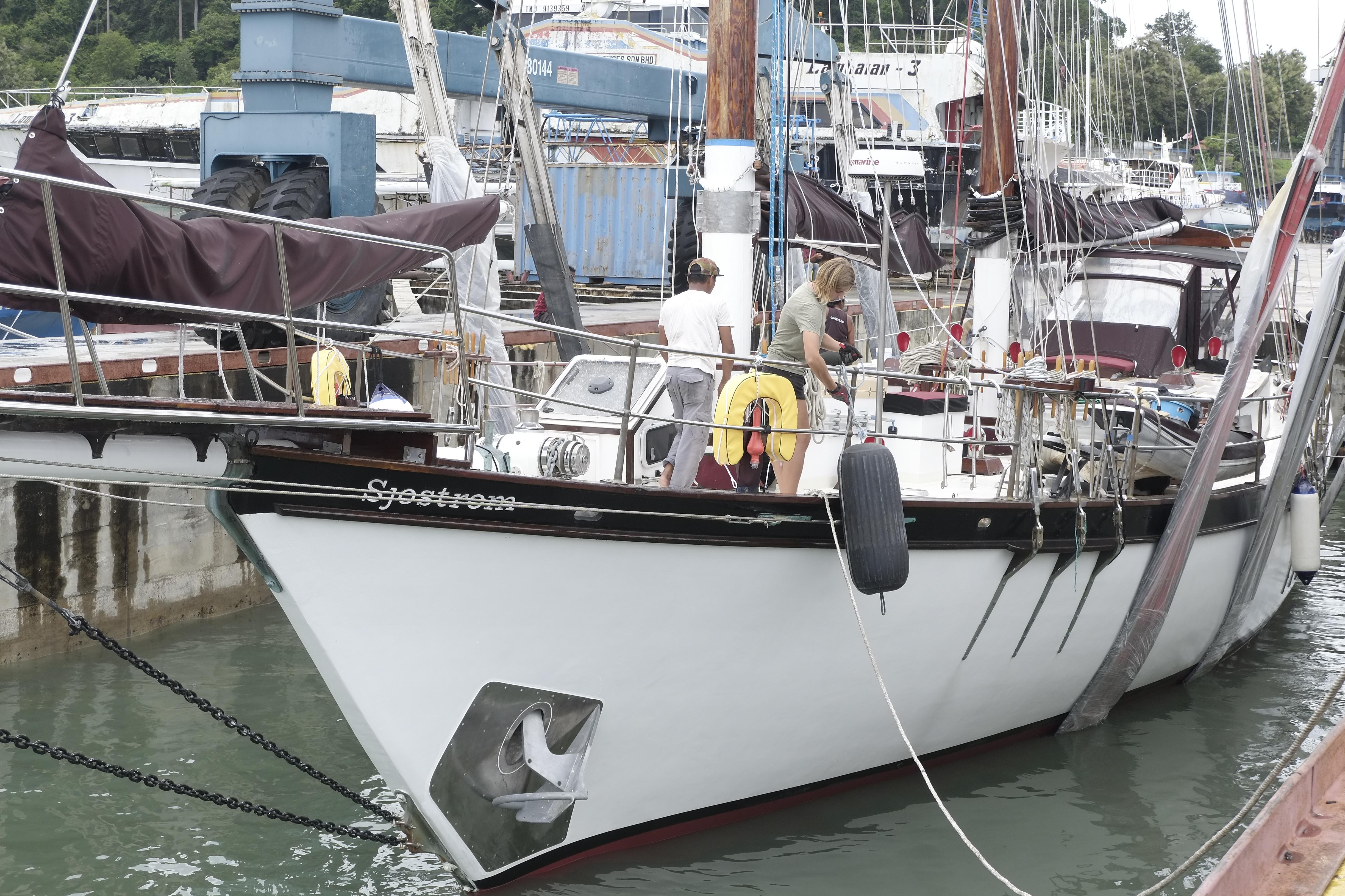 Custom Bud Macintosh schooner, 2006, docked at marina with people on deck.