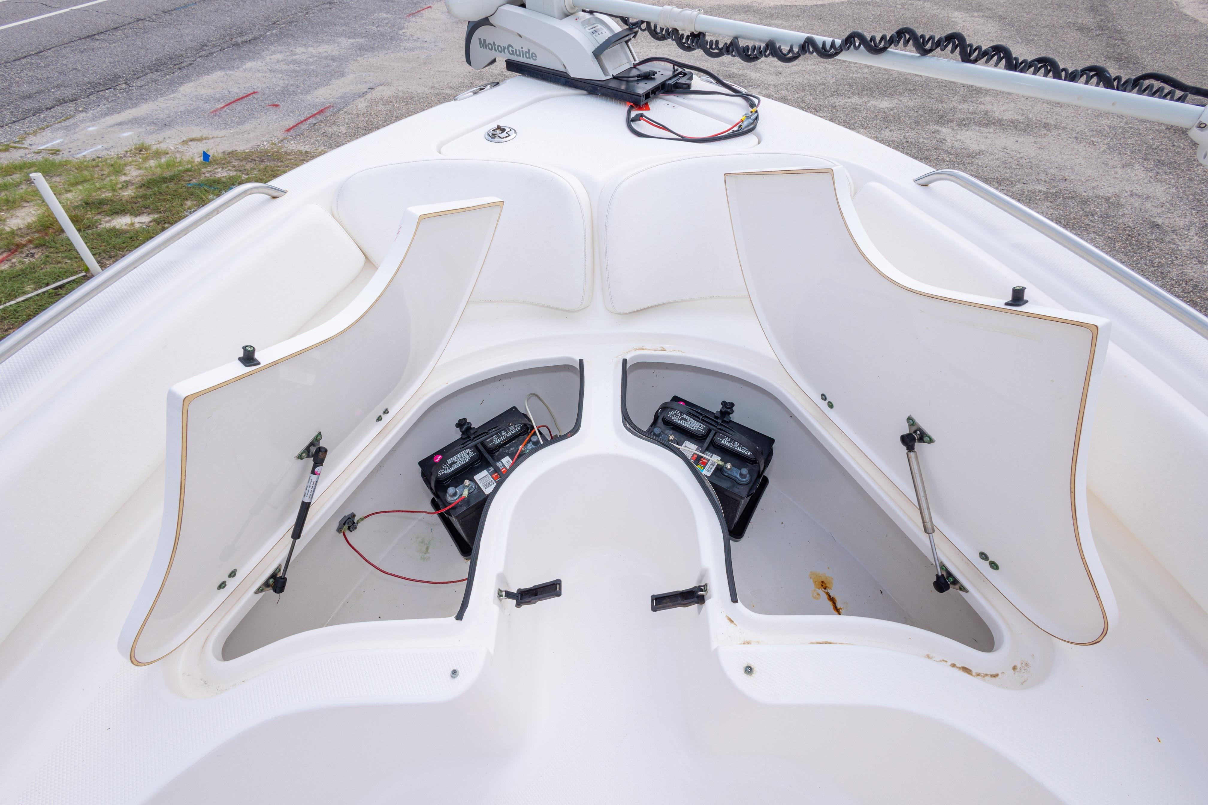 2014 Sea Fox 209 Commander boat storage compartments with batteries visible.
