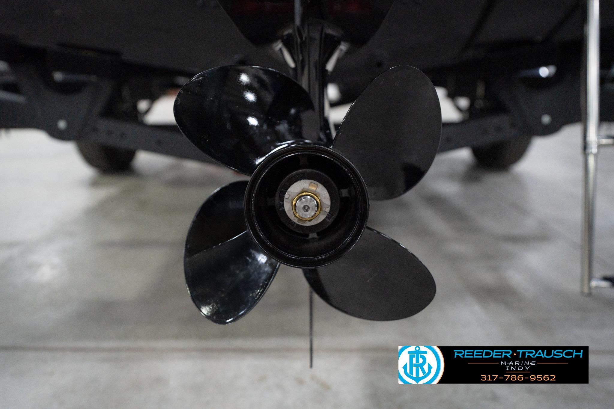 Propeller of 2026 Lund 1800 Explorer Sport boat in showroom setting.