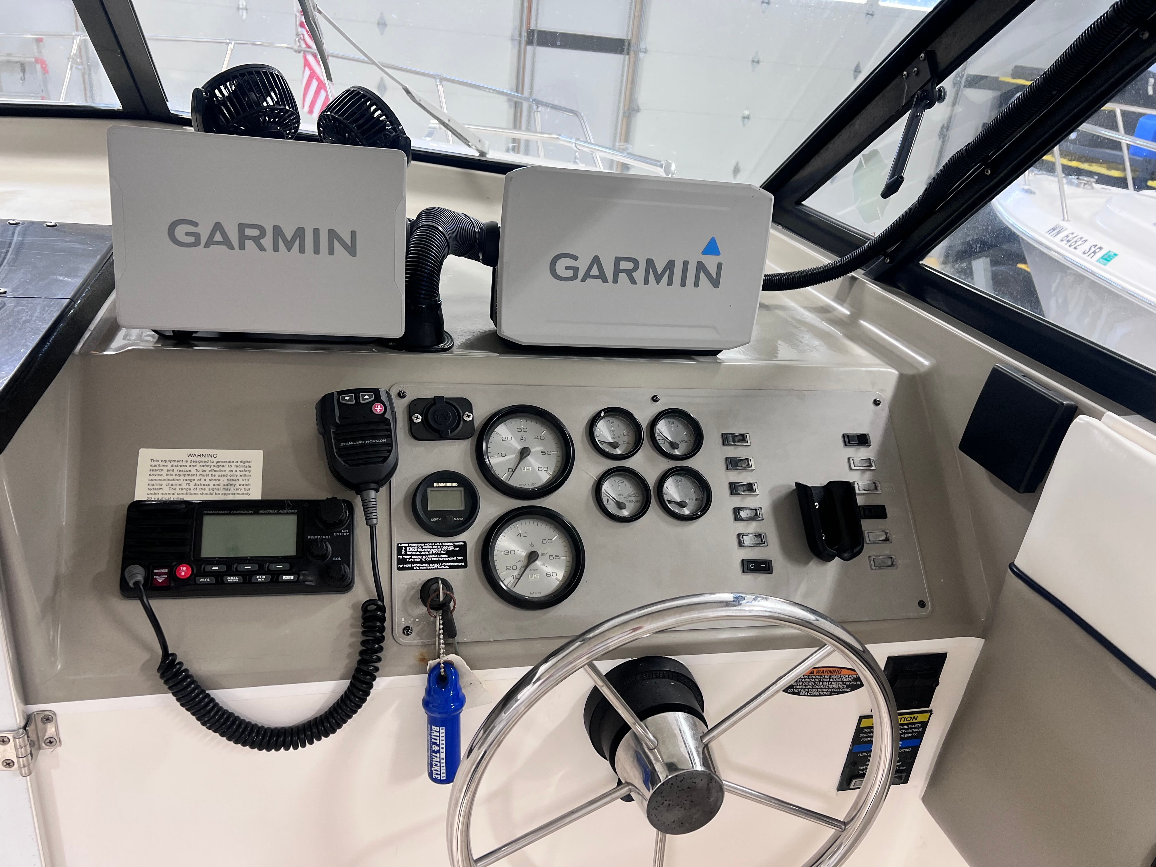 Dashboard of a 1997 Bayliner 2452 with Garmin devices.