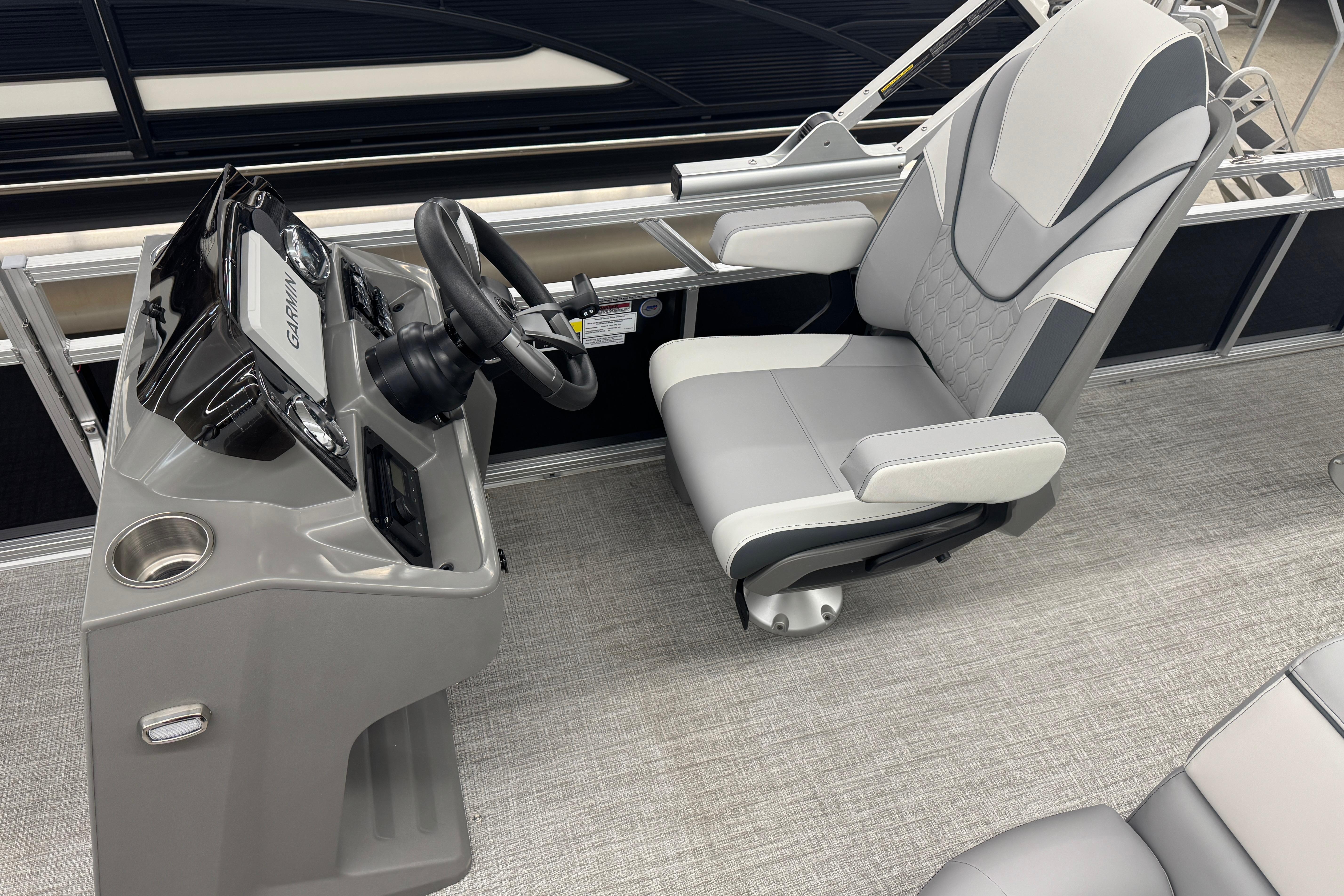 2026 Avalon Venture 85 RF boat cockpit with modern steering and comfortable seating.