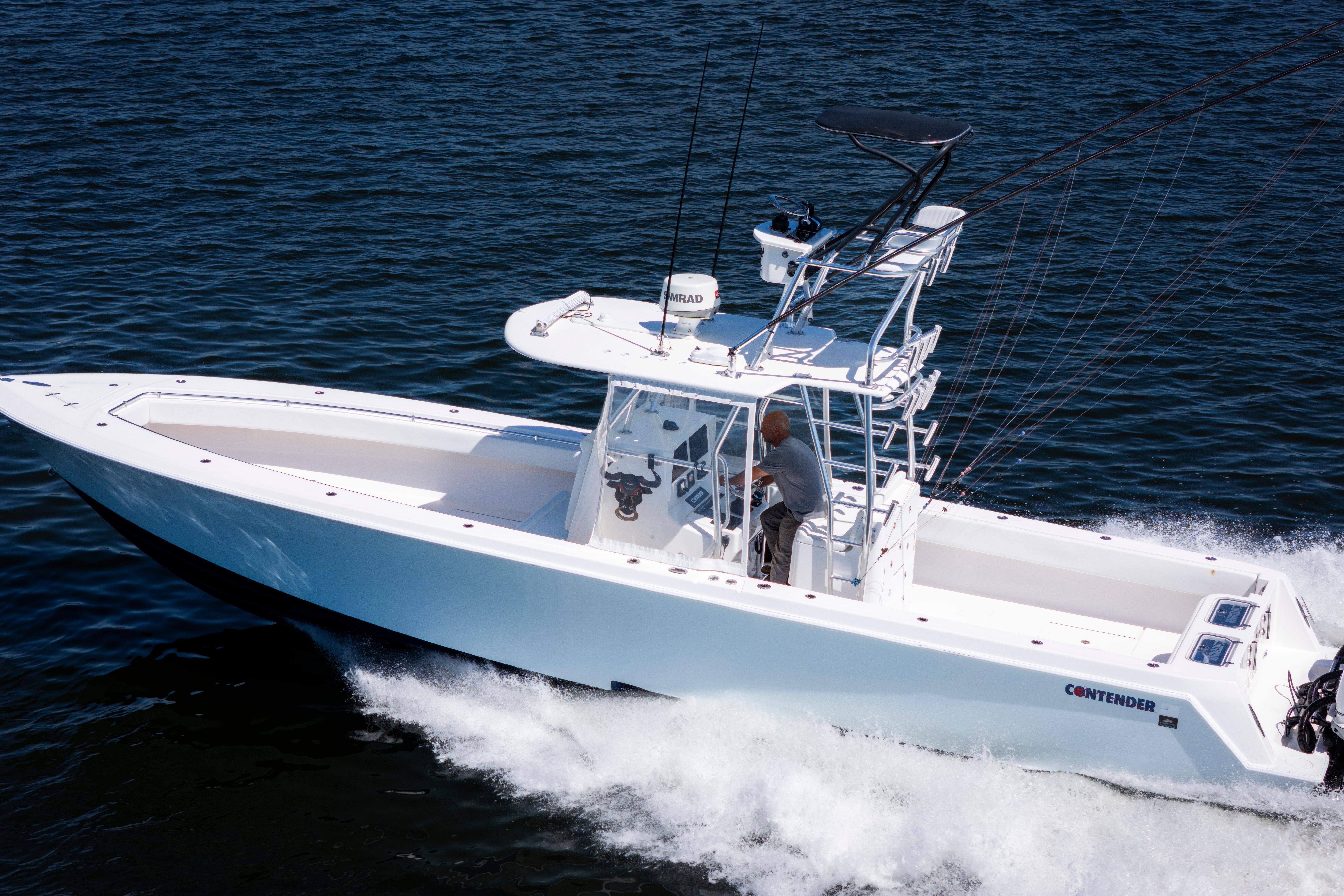 2015 Contender 39 ST boat cruising on open water, showcasing sleek design and performance.