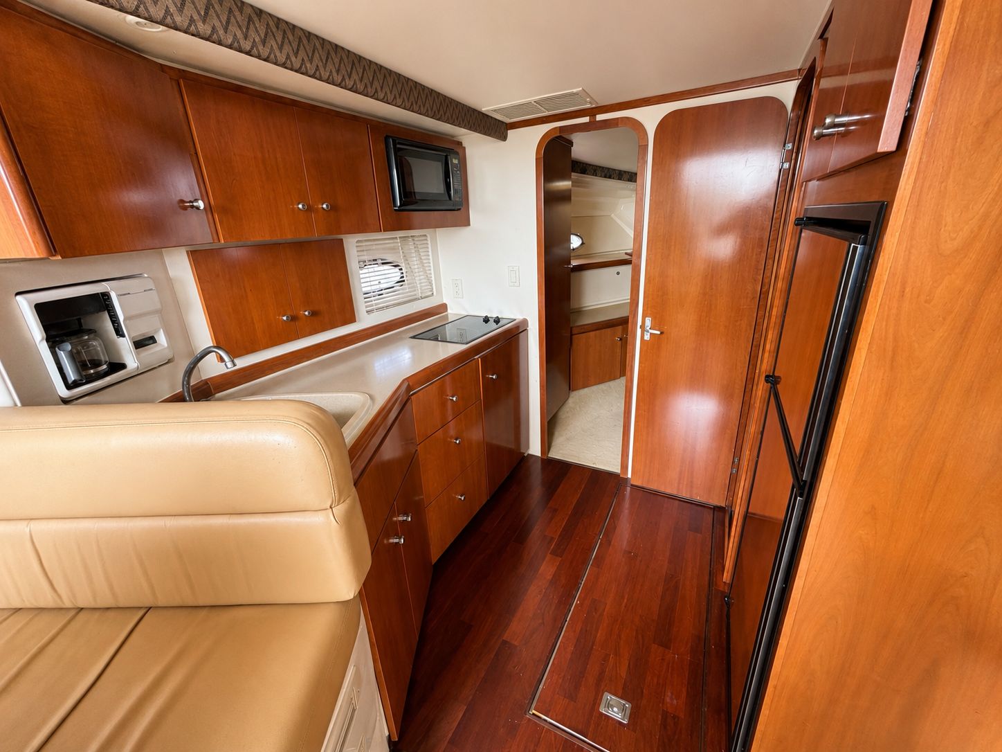 Interior of the 2001 Carver 350 Mariner with wooden cabinetry and modern amenities.