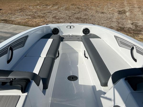 2024 Tahoe T21 boat interior with cushioned seating and built-in speakers.