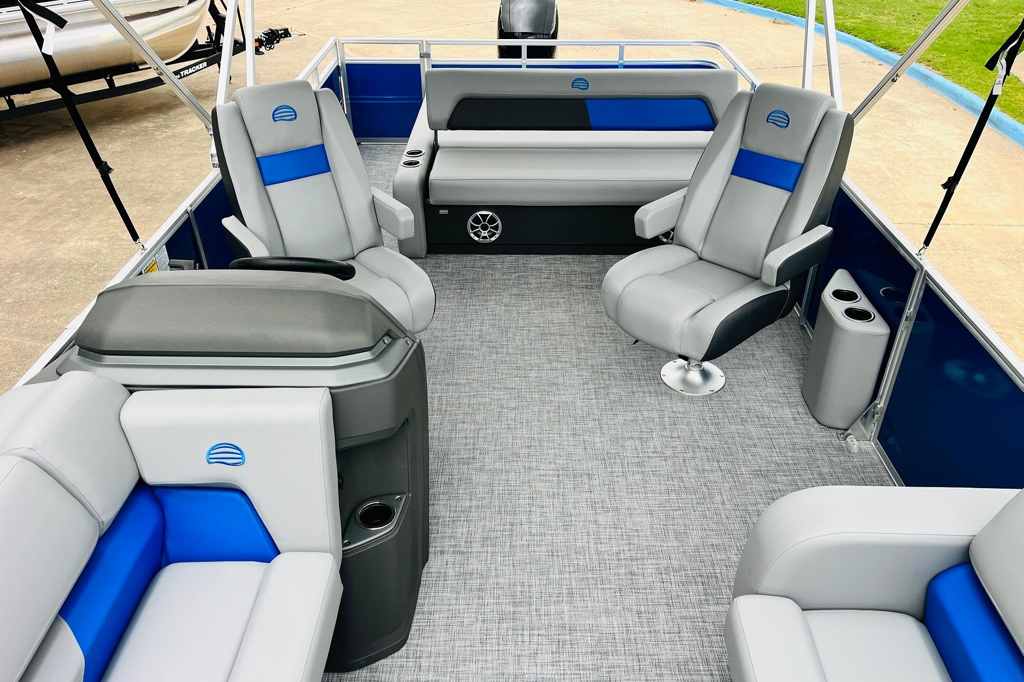 2026 Sun Tracker Party Barge 22 RF DLX interior with gray and blue seating.