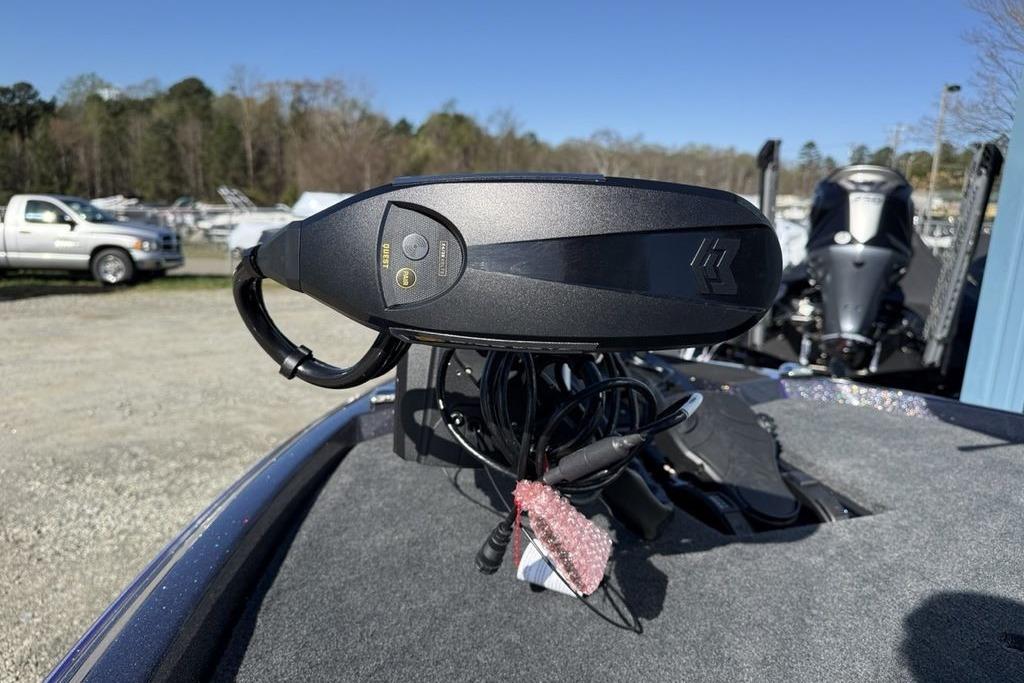 2026 Skeeter ZXE21 boat control panel with buttons, outdoors in a parking area.
