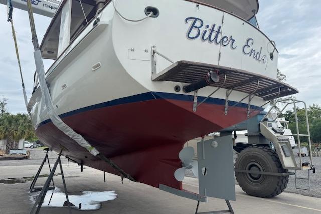 1986 Krogen 42 Classic boat named "Bitter End" on dry dock, showcasing hull and propeller.