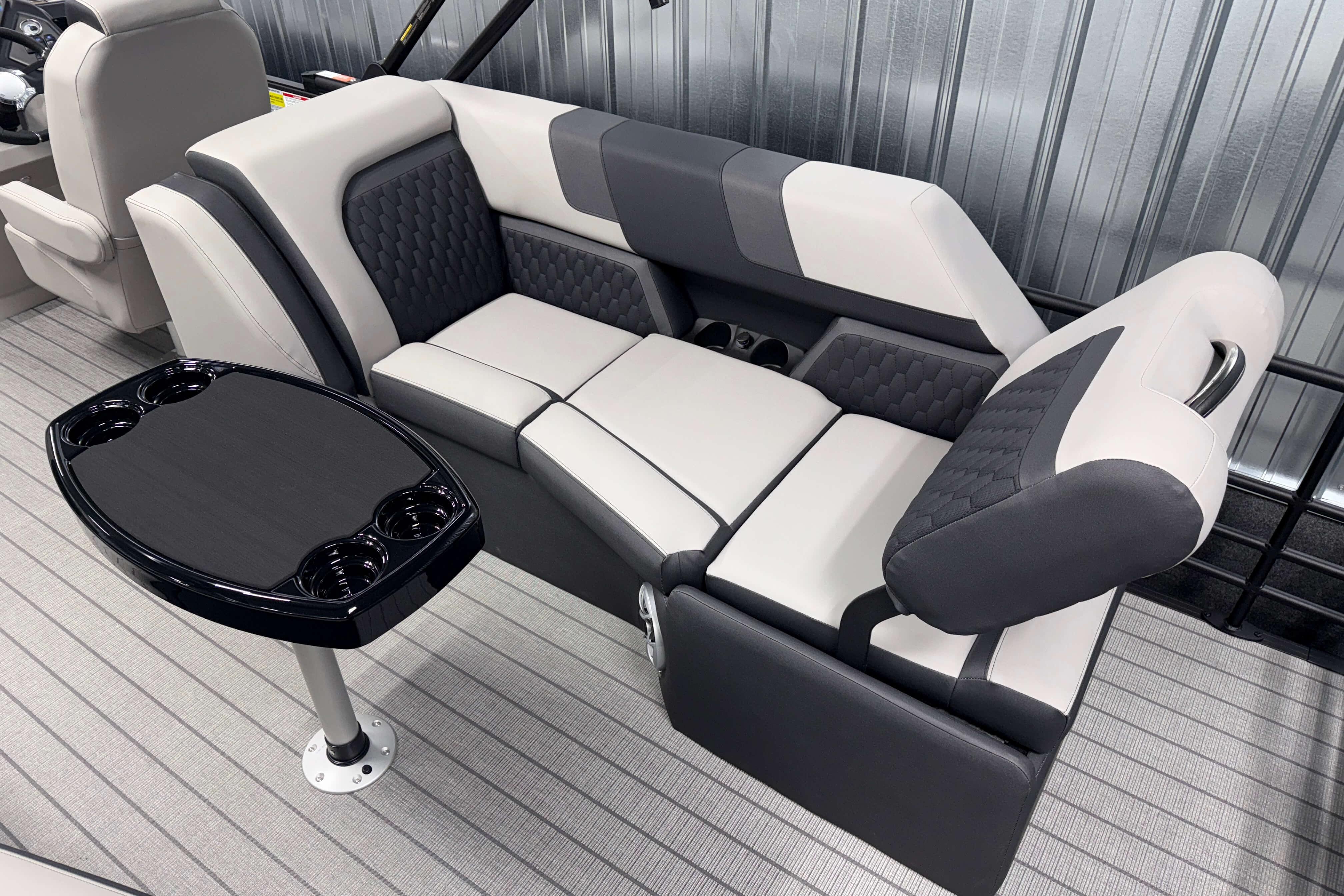 Luxurious seating in 2026 Sylvan L3 SLZ boat with sleek design and integrated cup holders.