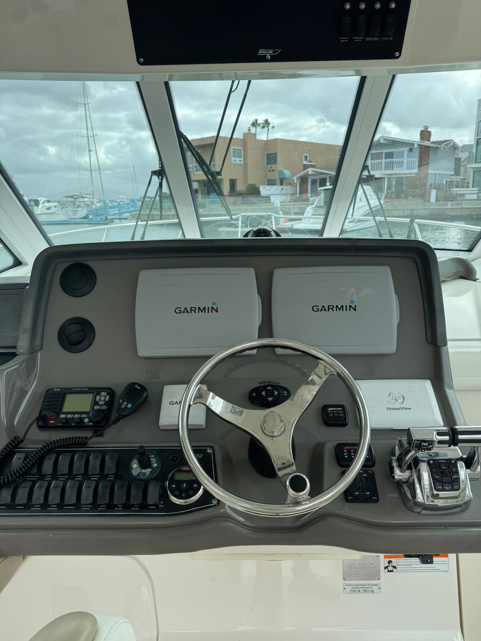 The cockpit of a 2008 Boston Whaler 345 Conquest with Garmin electronics and controls.