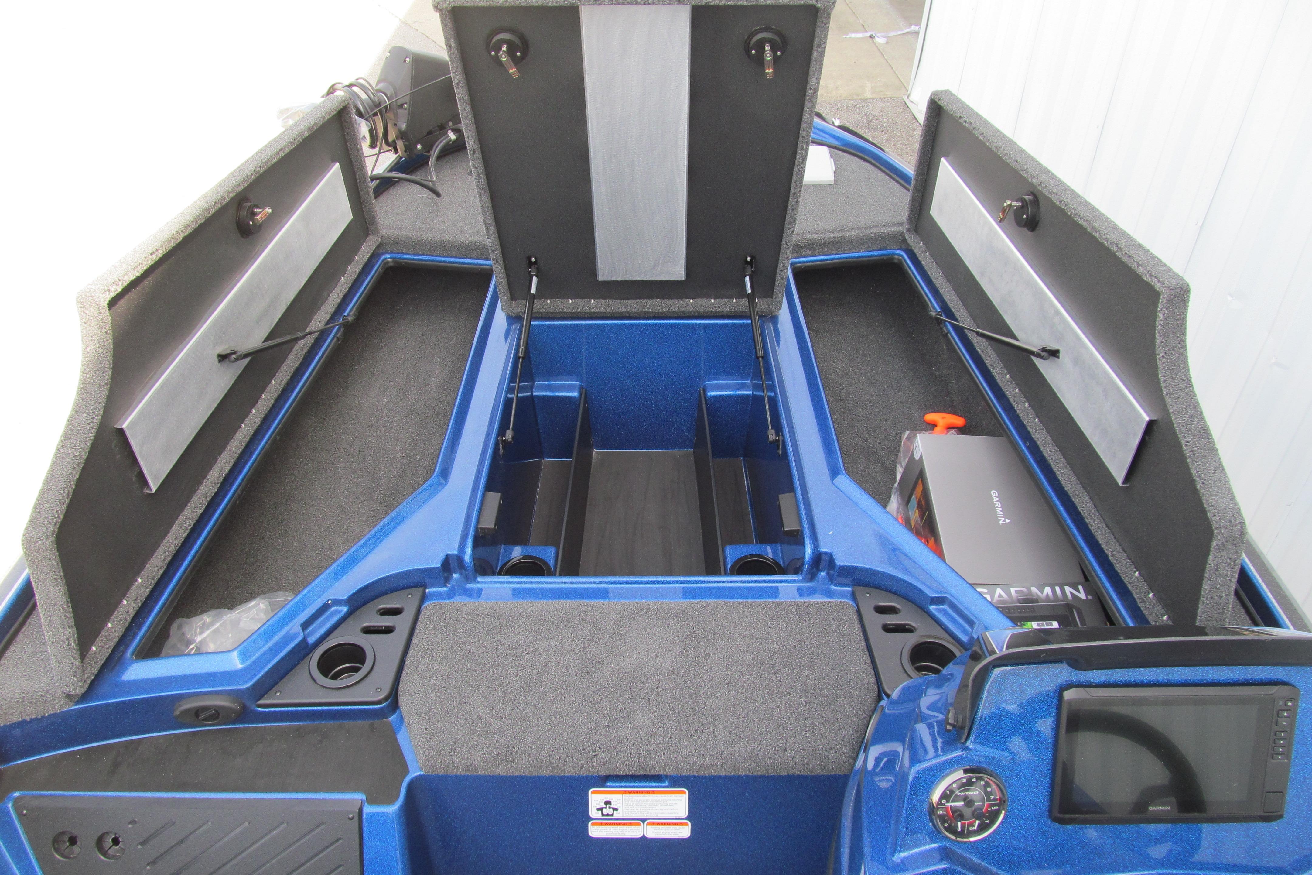 2026 Nitro Z18 Pro boat interior with open storage compartments and Garmin equipment.