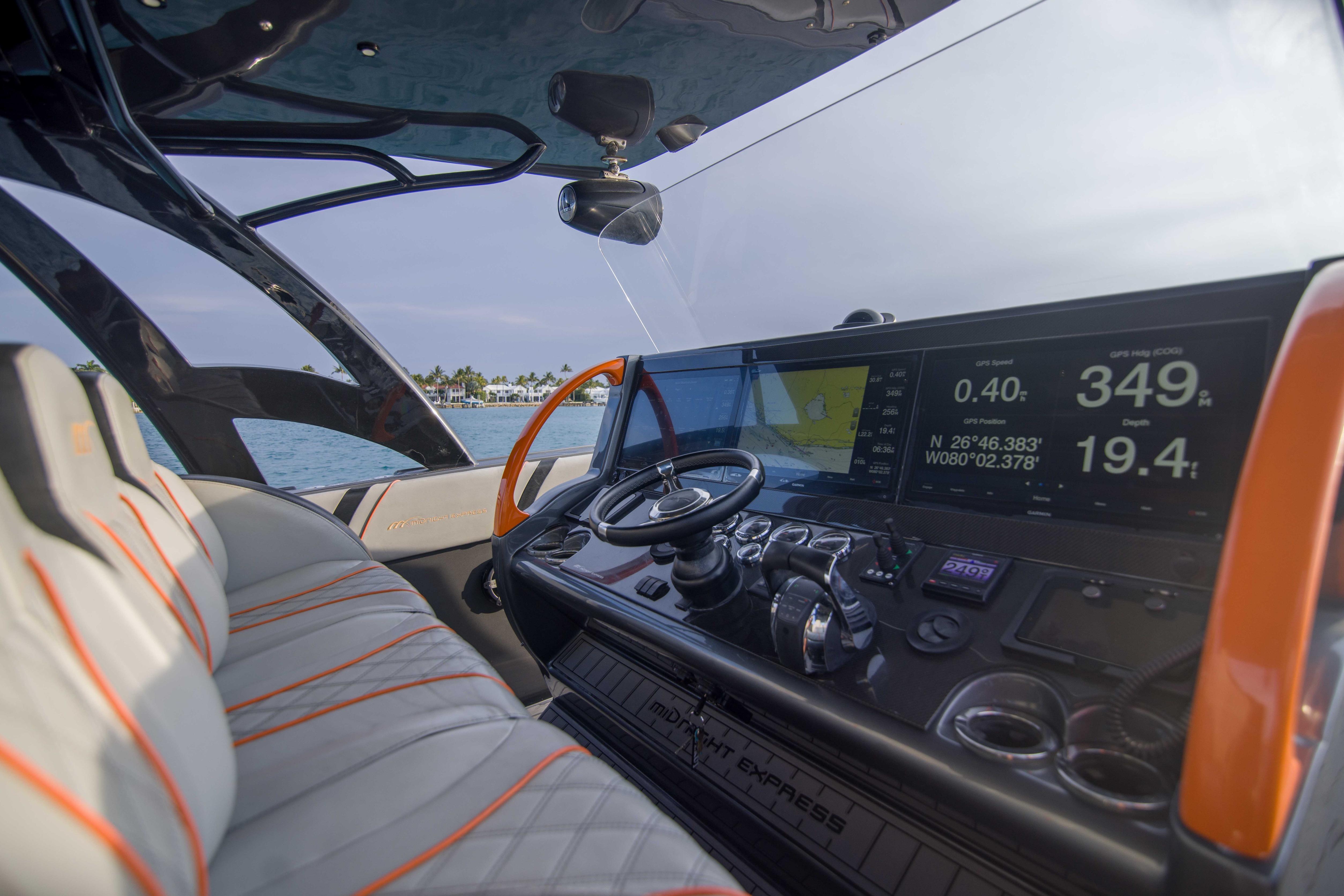 Interior view of 2019 Midnight Express 43 Open boat cockpit with advanced navigation system.