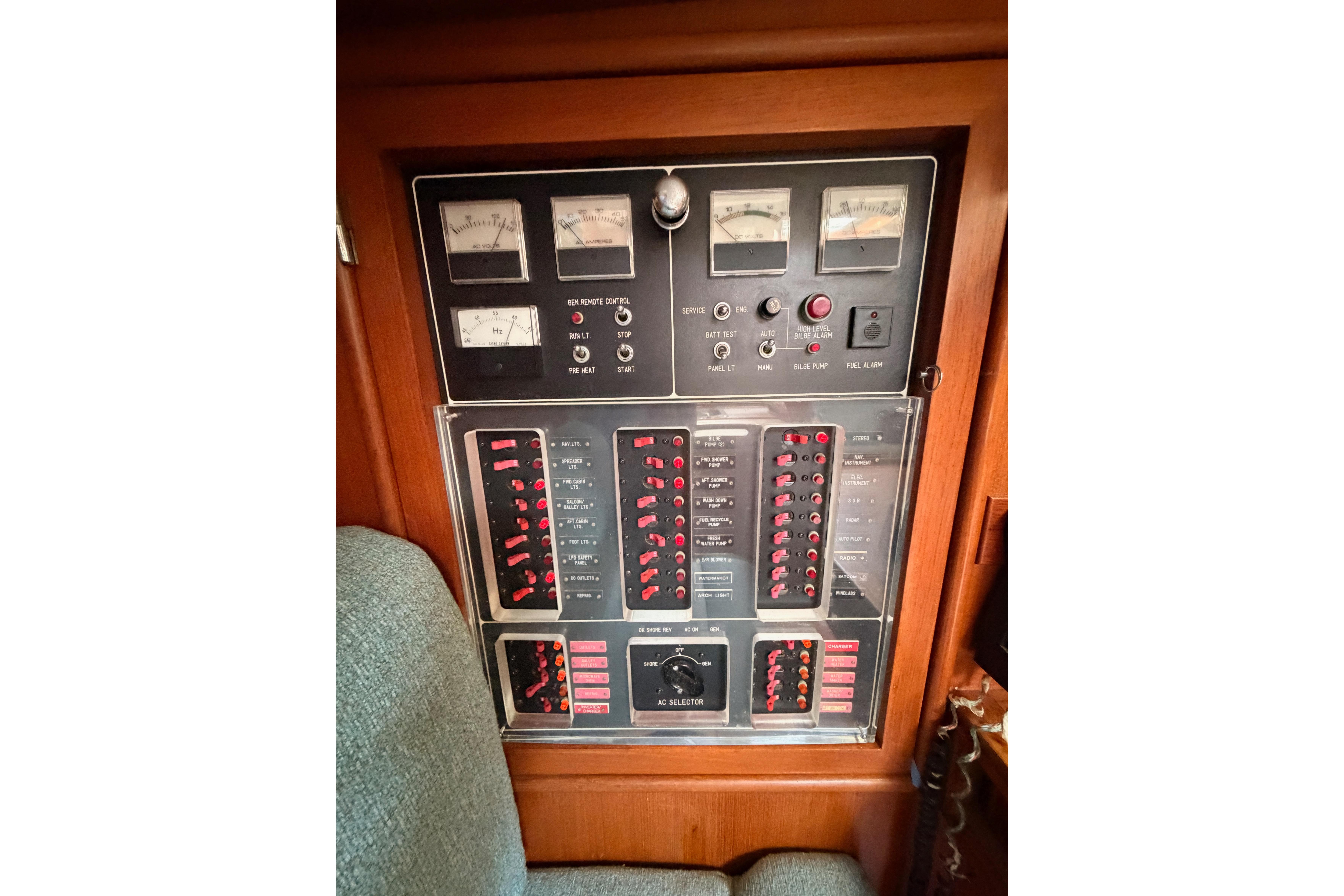 Electrical control panel on a 1991 Hylas 51 yacht, featuring gauges and switches.