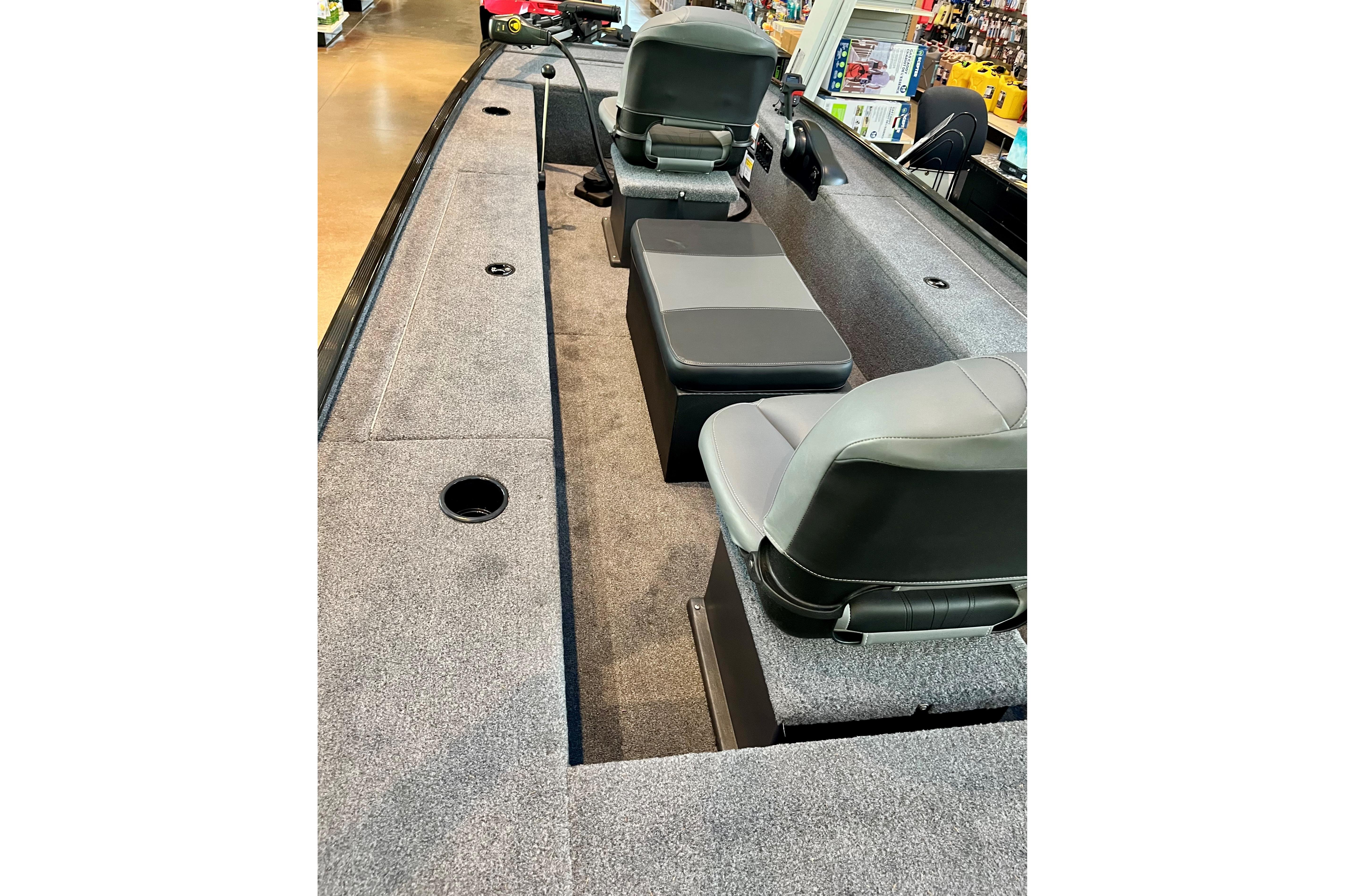 2026 Tracker Panfish 17 boat interior with seating and carpeted deck.