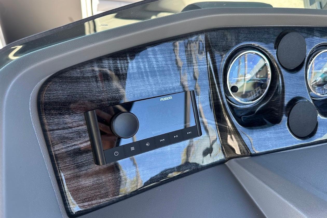 Dashboard of 2026 Tahoe Pontoon LTZ Quad Lounger Shift 23 with Fusion stereo system.