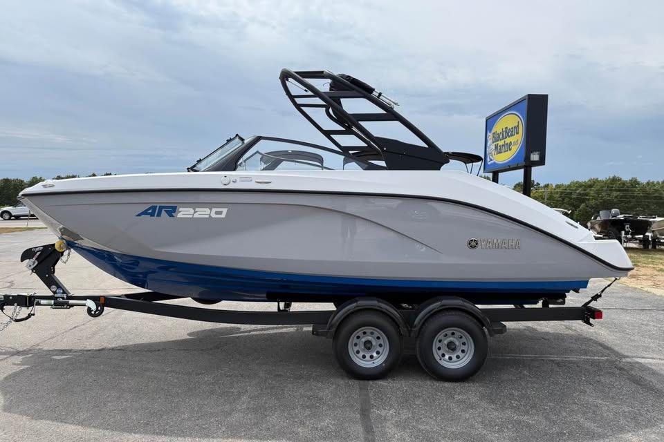 2026 Yamaha Boats AR220 on trailer, sleek design, parked outdoors.