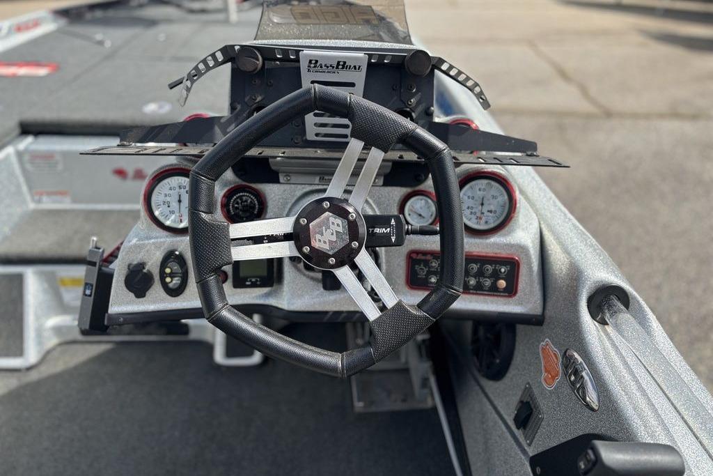 2020 Bass Cat Cougar FTD boat dashboard with steering wheel and gauges.