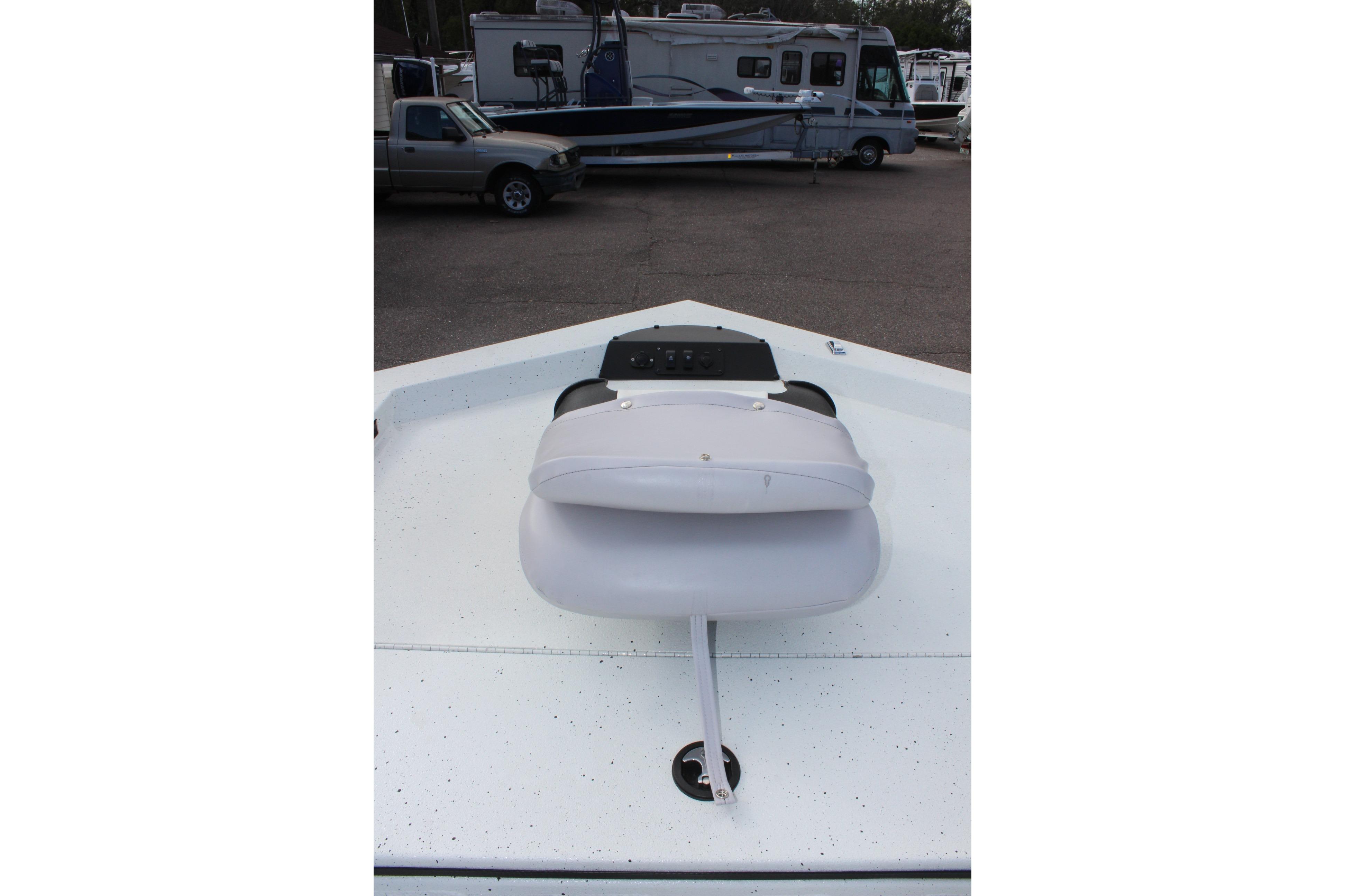 Bow view of 2025 Excel 2172 Stalker CC boat with seating and control panel.
