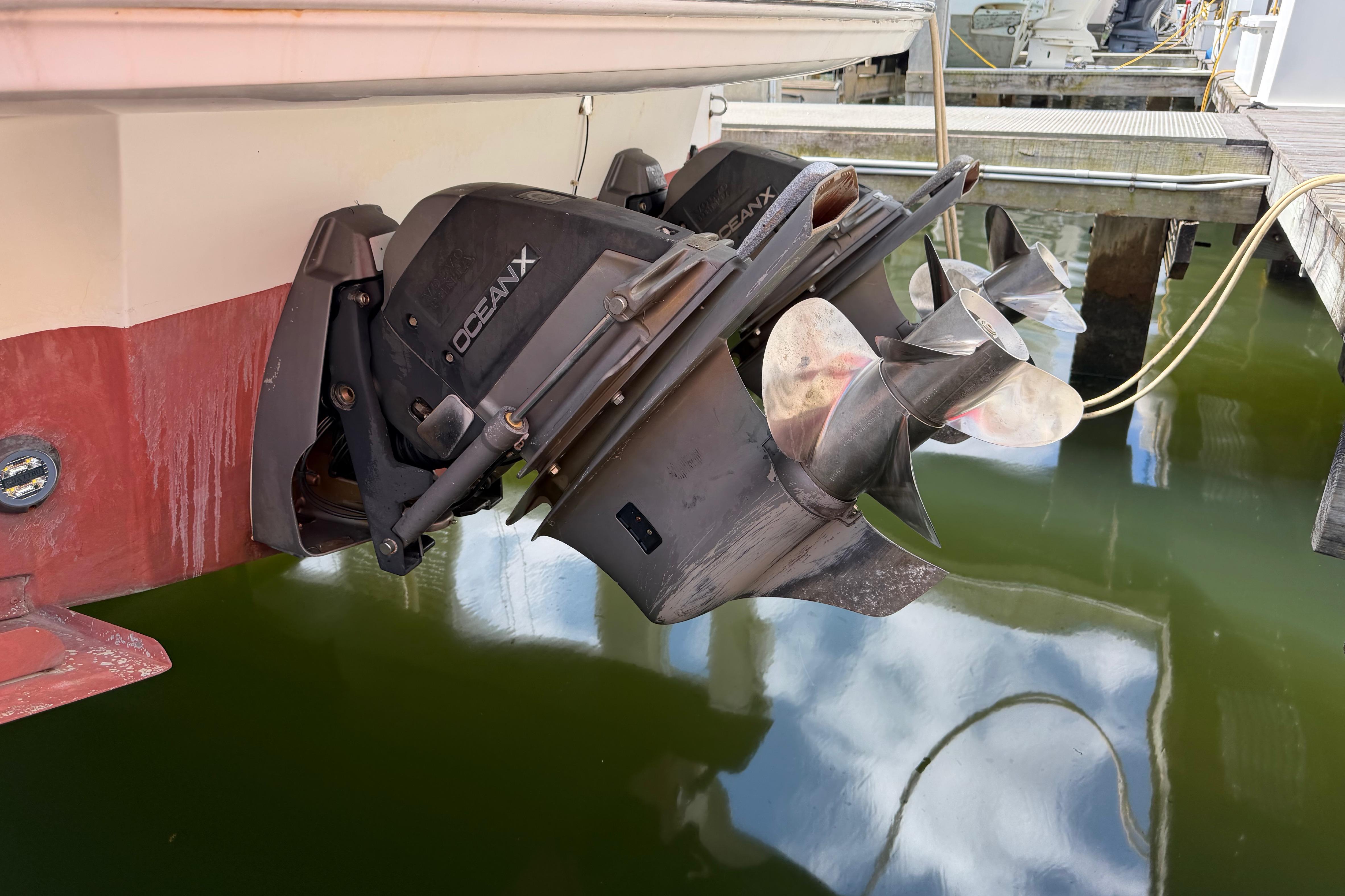 Outboard motor of 2007 Monterey 350 Sport Yacht with OceanX drive in marina.
