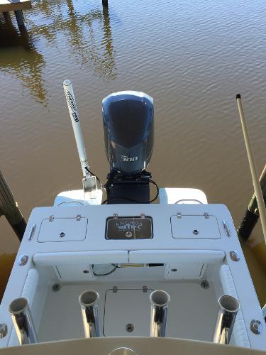 The image shows the stern of an Andros 26 Tarpon boat with an outboard motor.