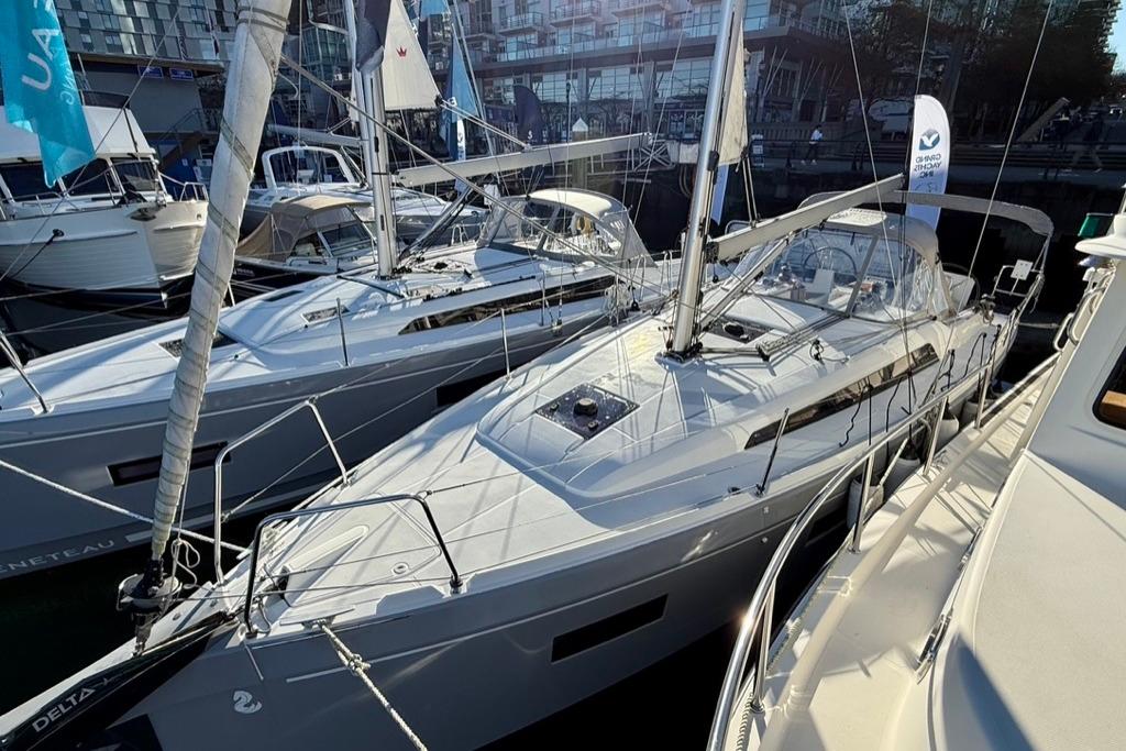 2023 Beneteau Oceanis 34.1 sailboat docked at a marina, showcasing sleek design.