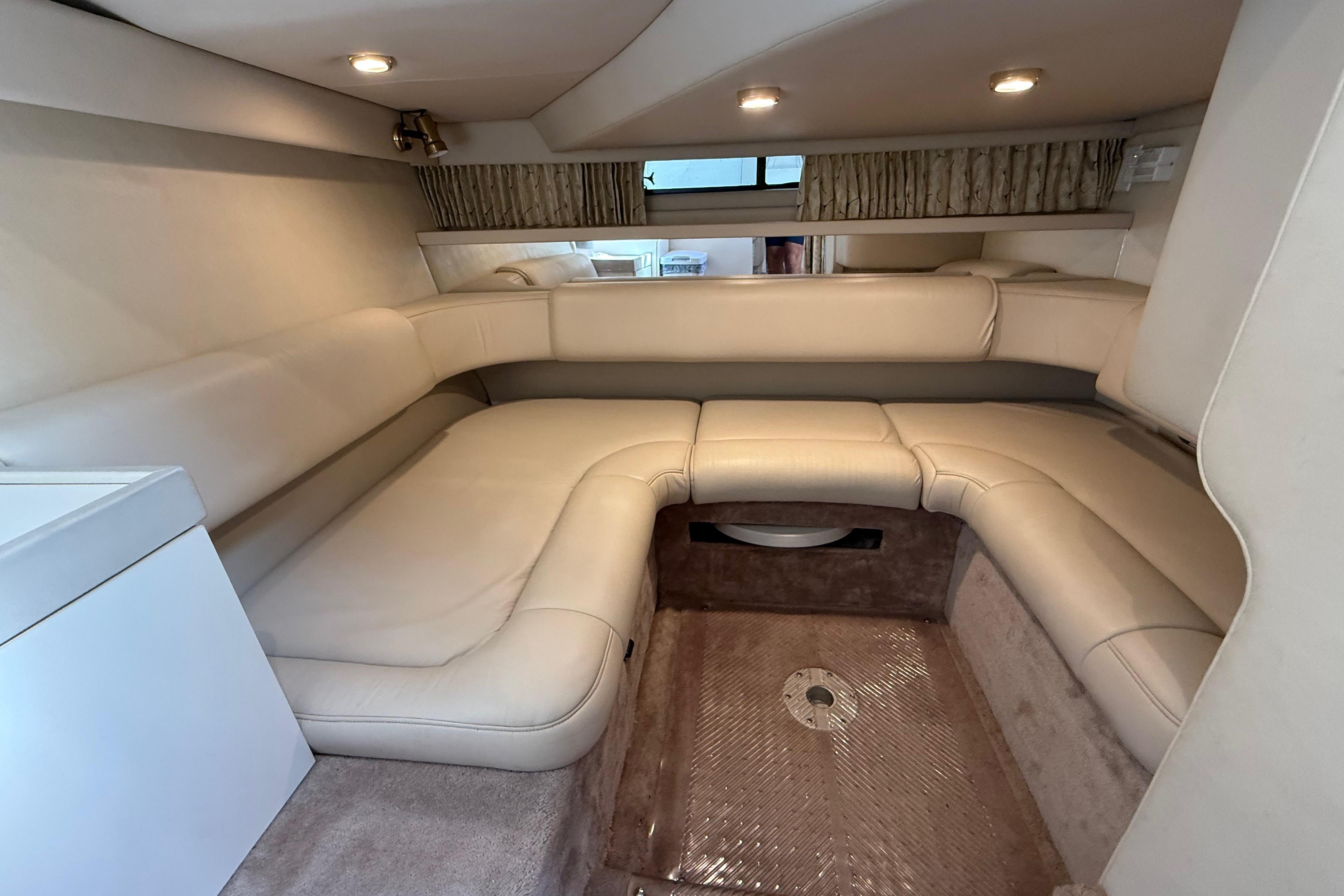 1999 Formula 34 Performance Cruiser interior with beige seating and modern lighting.