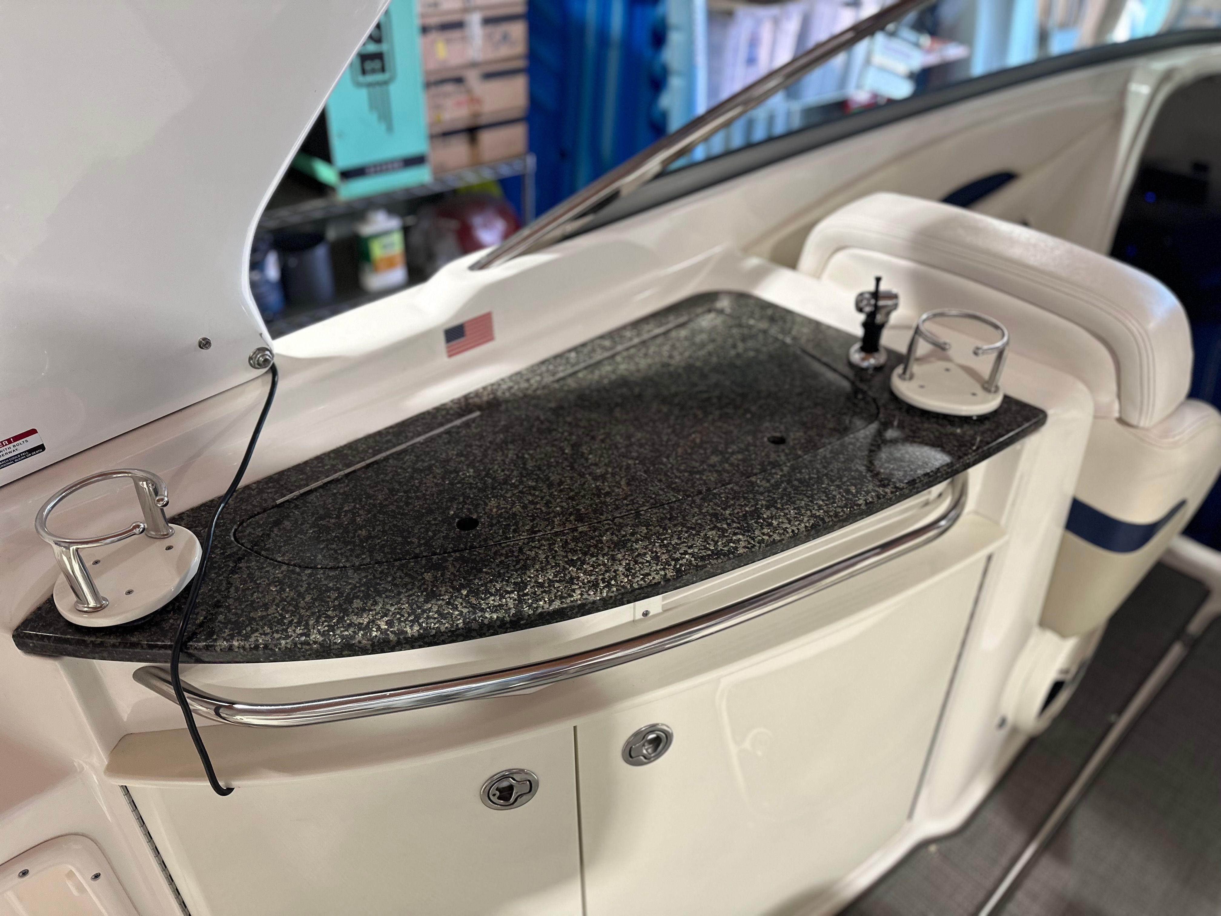 The 2011 Chaparral 287 SSX cabin features a sleek countertop with cup holders.