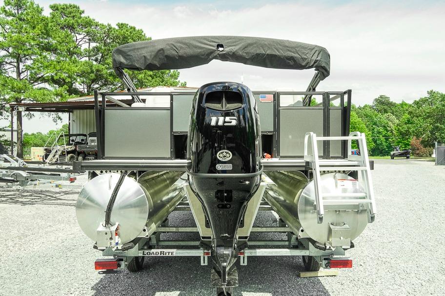 2026 Dockside 22DF pontoon boat with 115 HP engine on a trailer, parked outdoors.