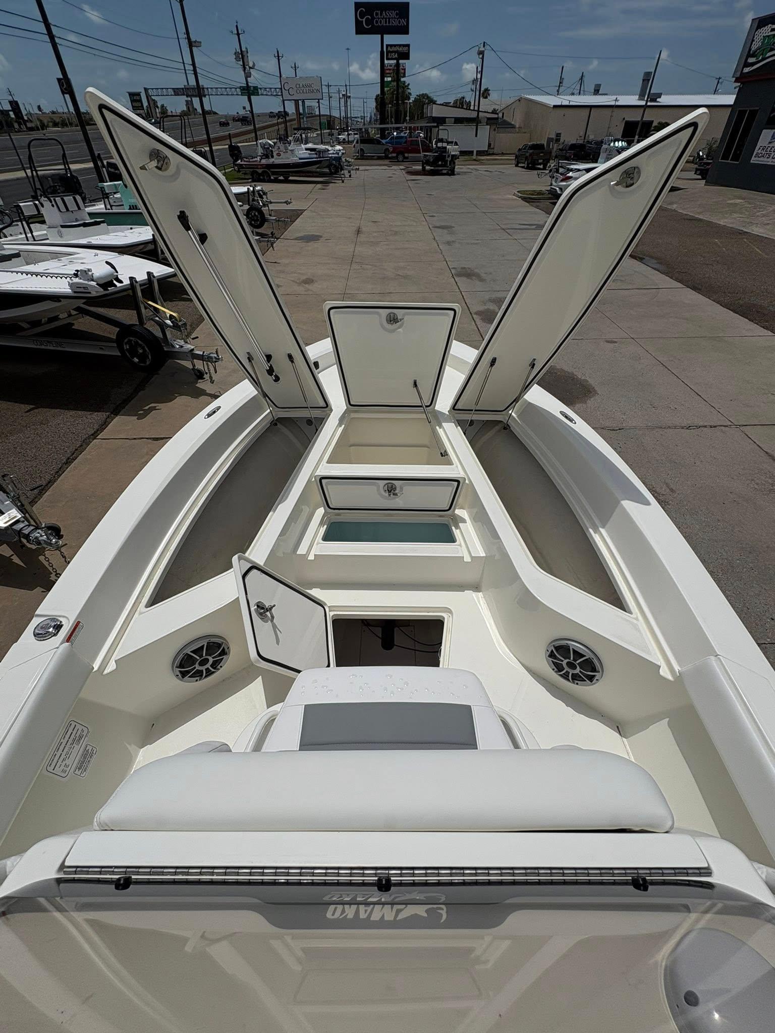 2025 Mako 24 APEX boat interior with open storage compartments and seating.
