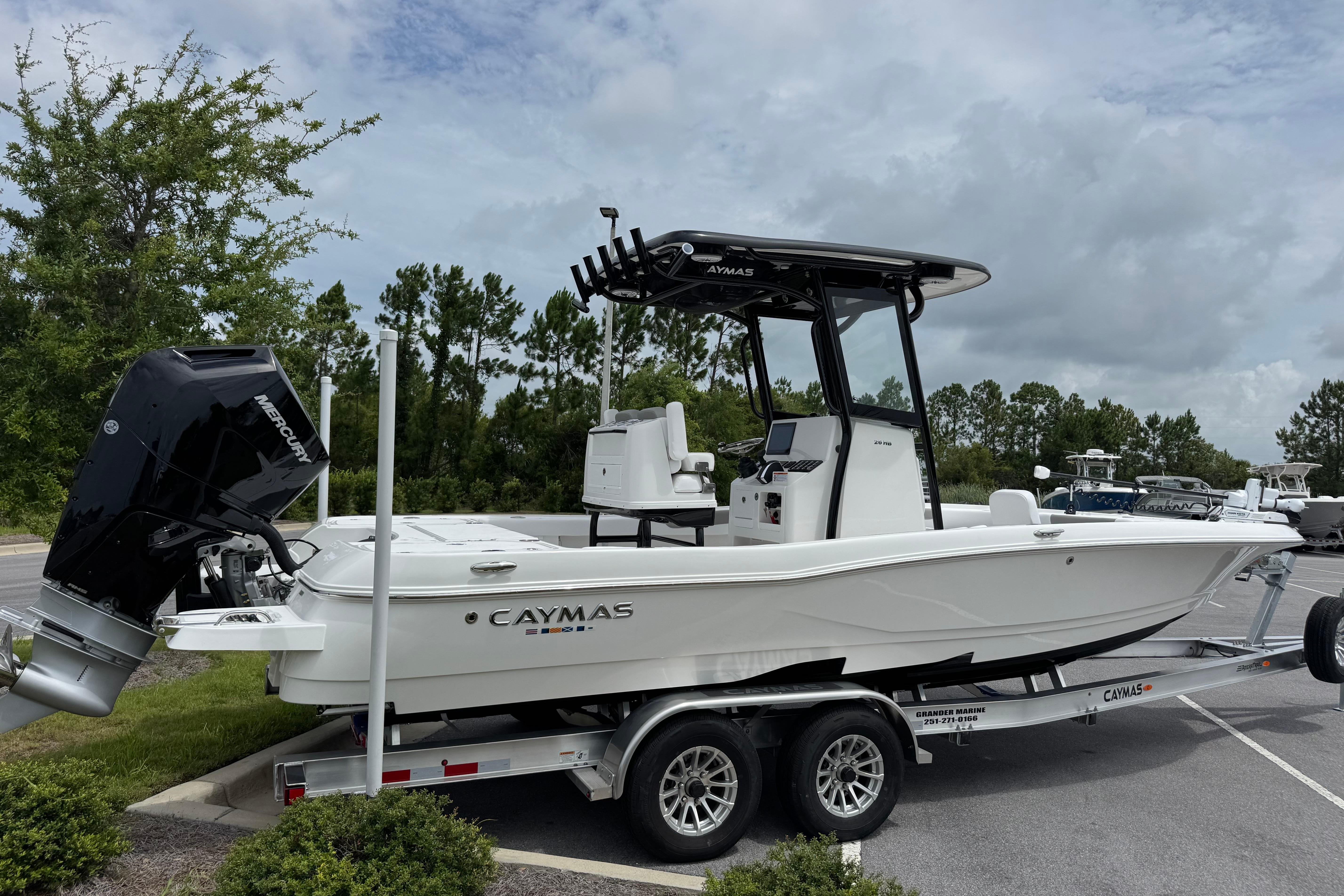 2027 Caymas 26 HB boat on trailer, featuring sleek design and powerful Mercury engine.