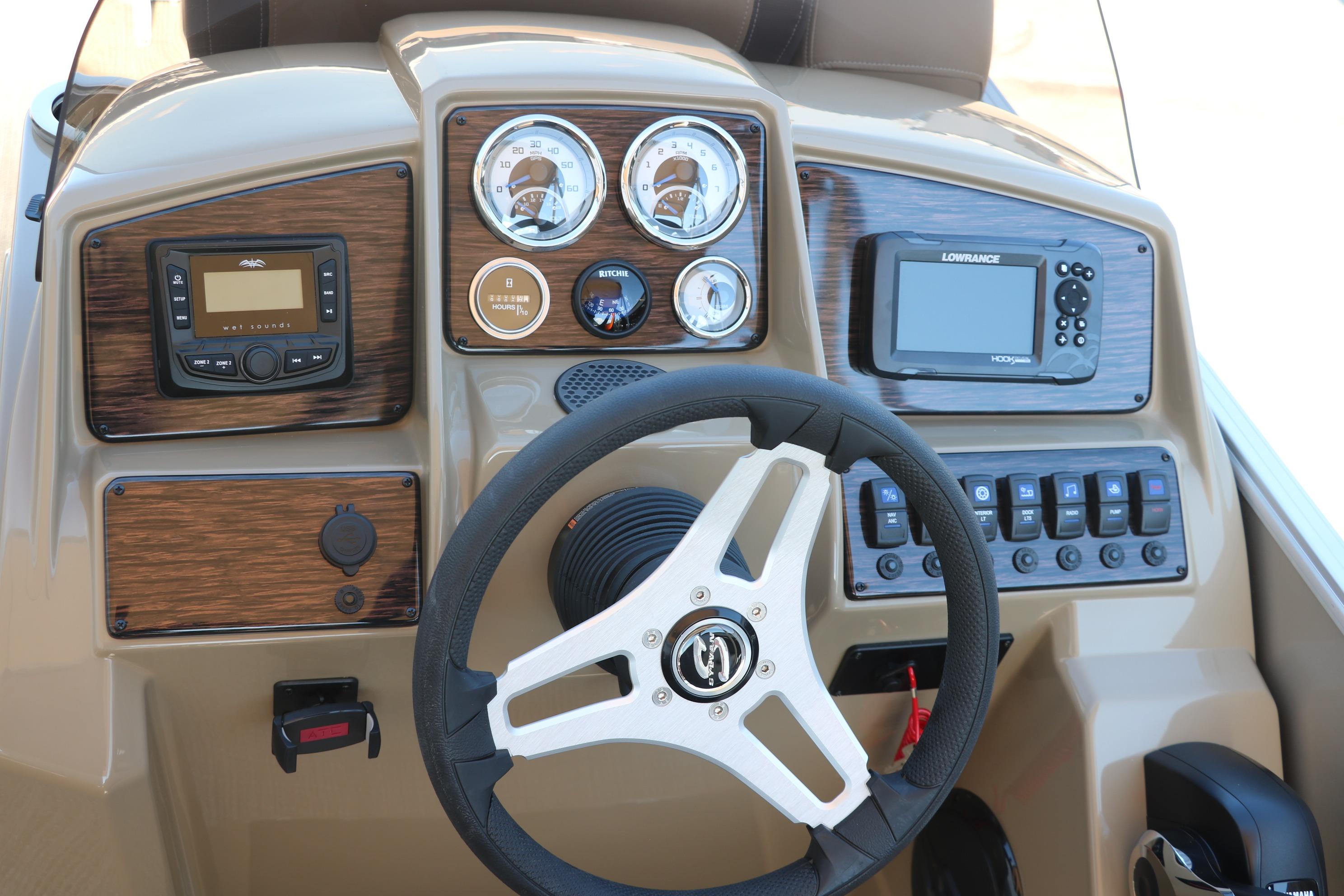 Dashboard of 2025 Sylvan Mirage 820 CLZ DH boat with steering wheel and controls.