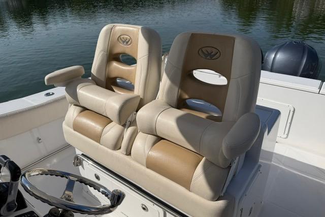 2014 Southport 29 FE boat seats with armrests on a calm water backdrop.