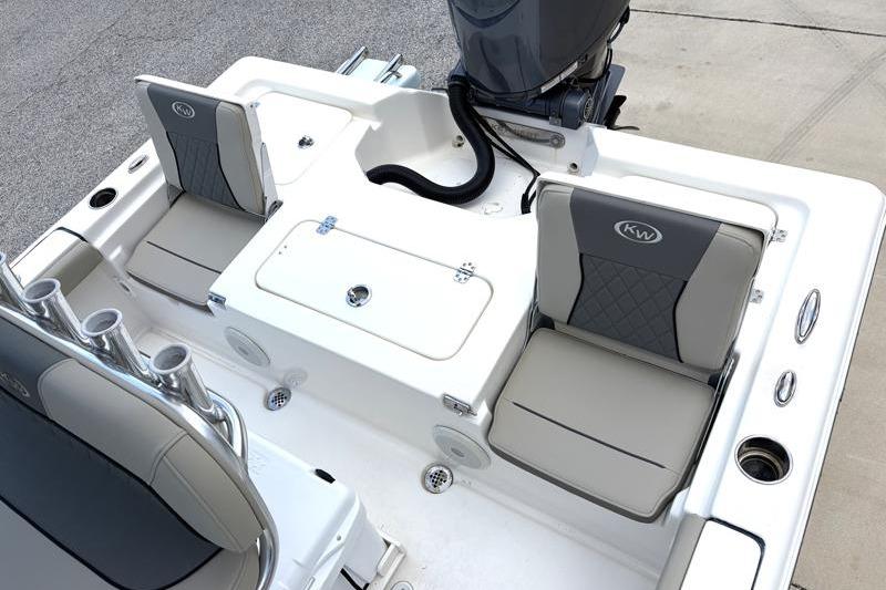 2025 Key West 210 Bay Reef boat interior with seating and storage compartments.