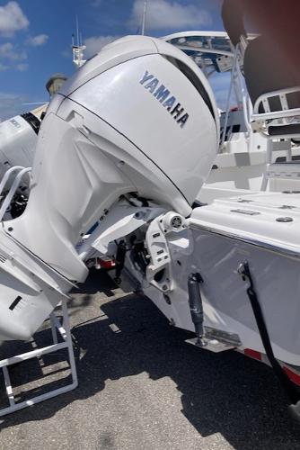 2025 Sea Pro 202 Center Console with Yamaha outboard motor, docked under clear blue sky.