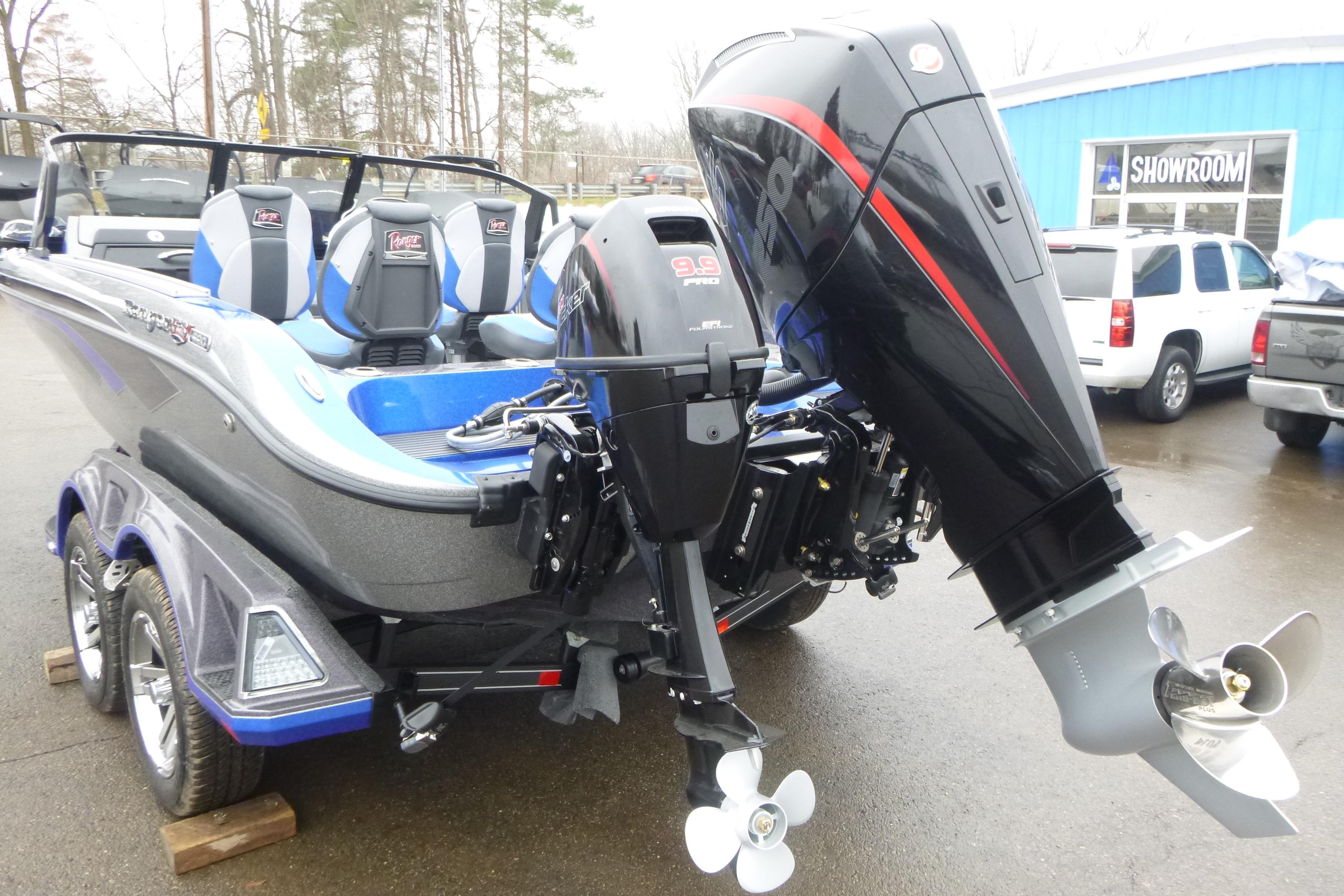 2026 Ranger 620FS Cup Equipped boat with powerful outboard motor in showroom setting.