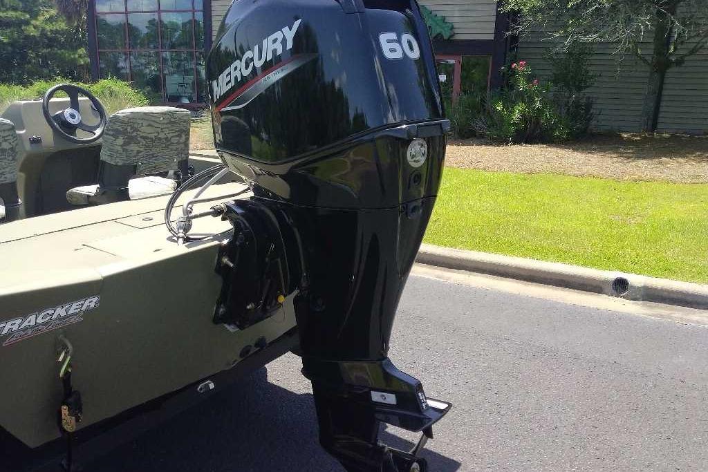 2026 Tracker Grizzly 1754 SC boat with Mercury 60 outboard motor on a sunny day.