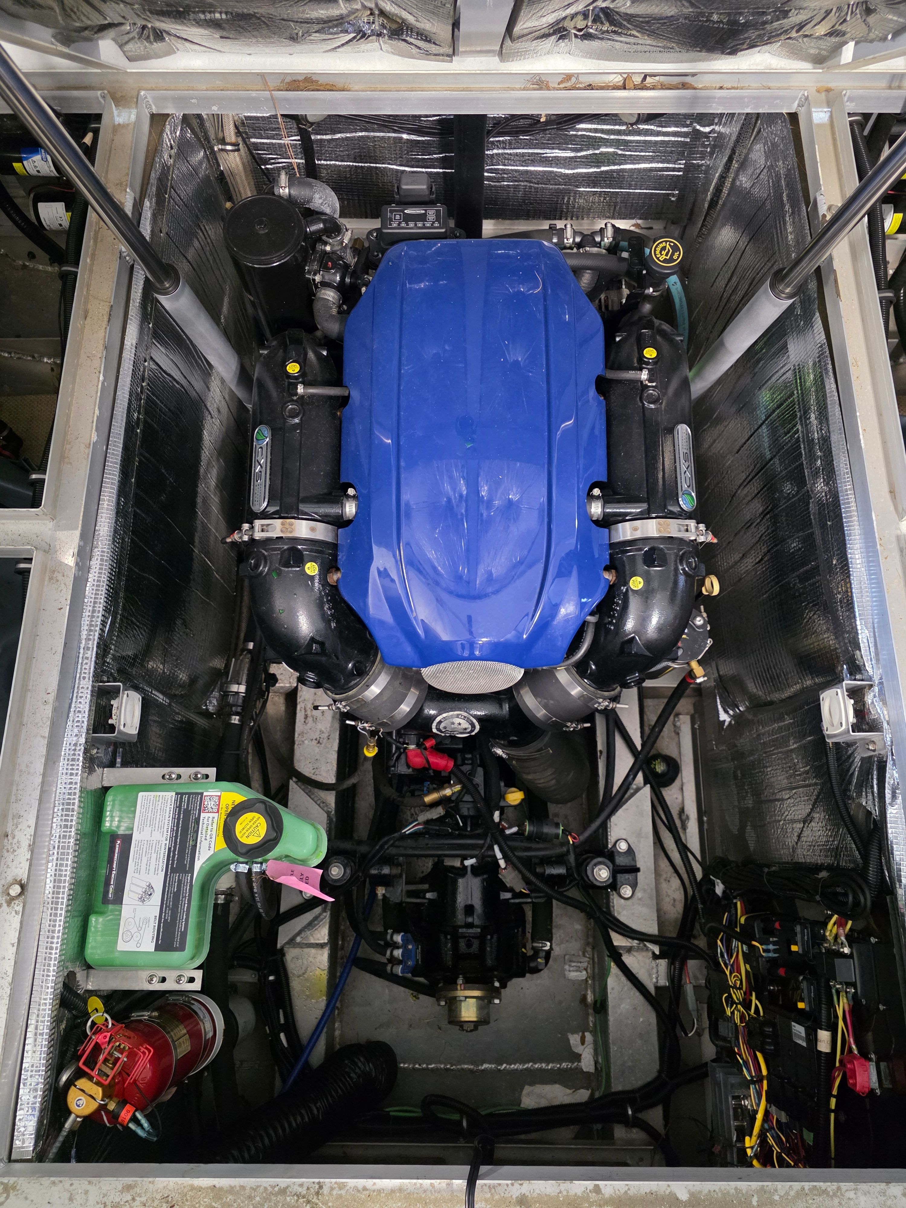 Engine compartment of 2021 Montara SURF BOSS 25 with blue engine.
