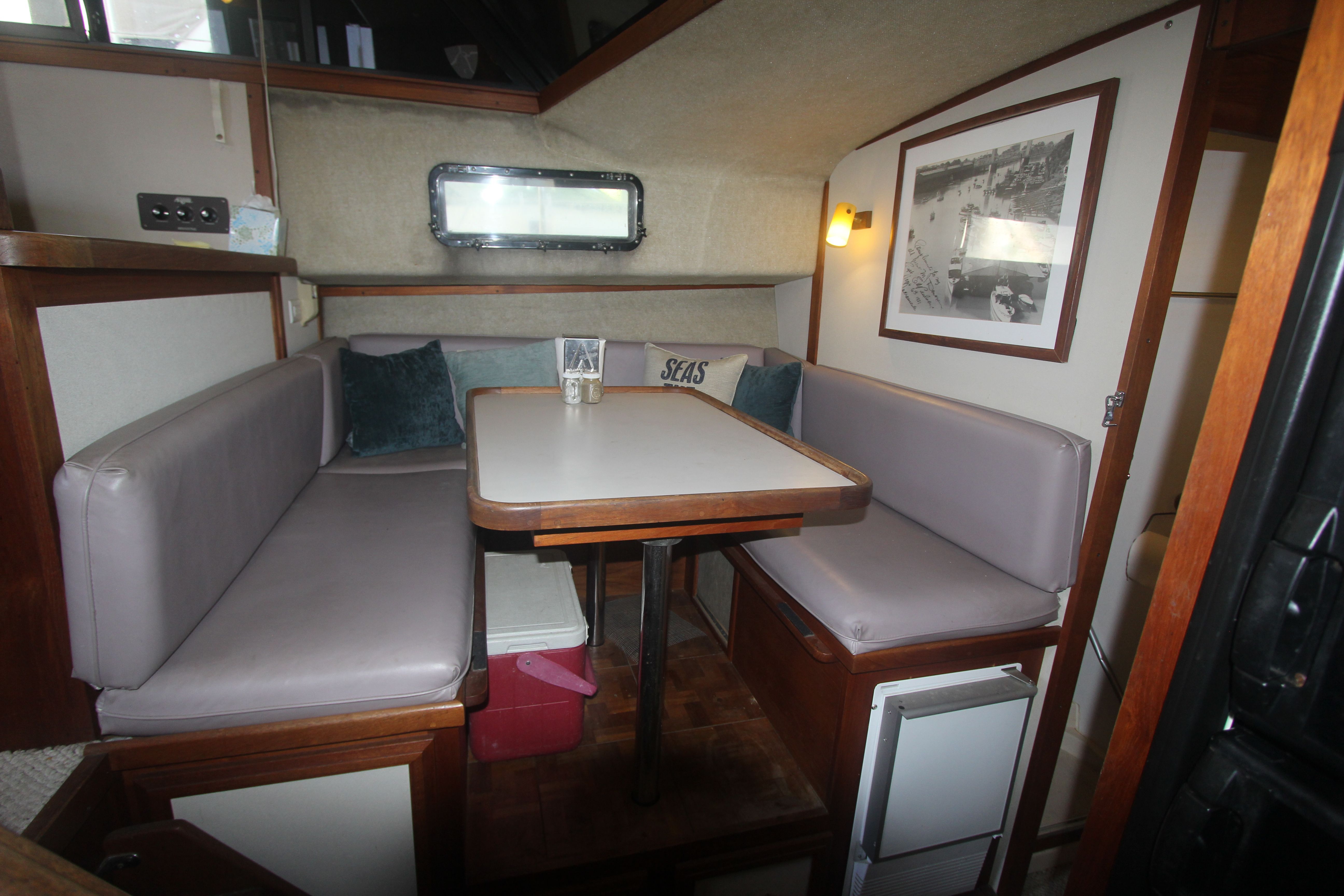 Interior of the 1988 Carver 3607 Aft Cabin Motor Yacht with a cozy seating area.
